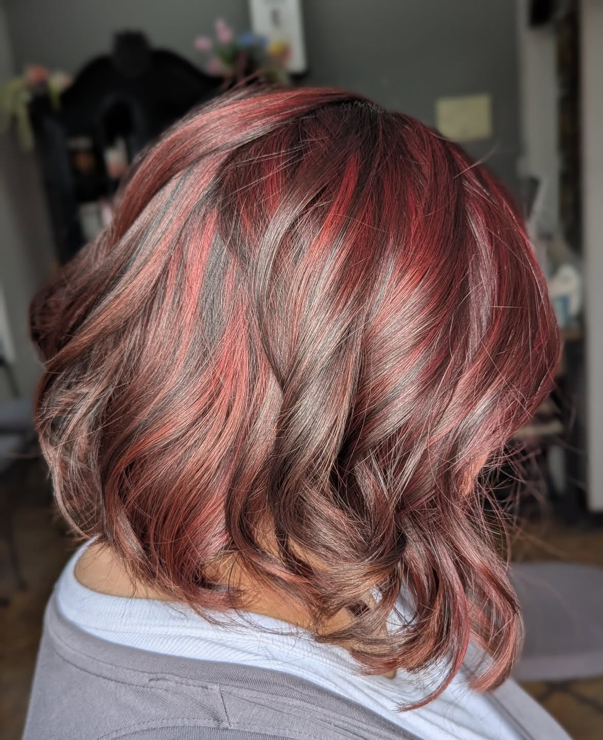 Chic Textured Bob with Fiery Red Highlights