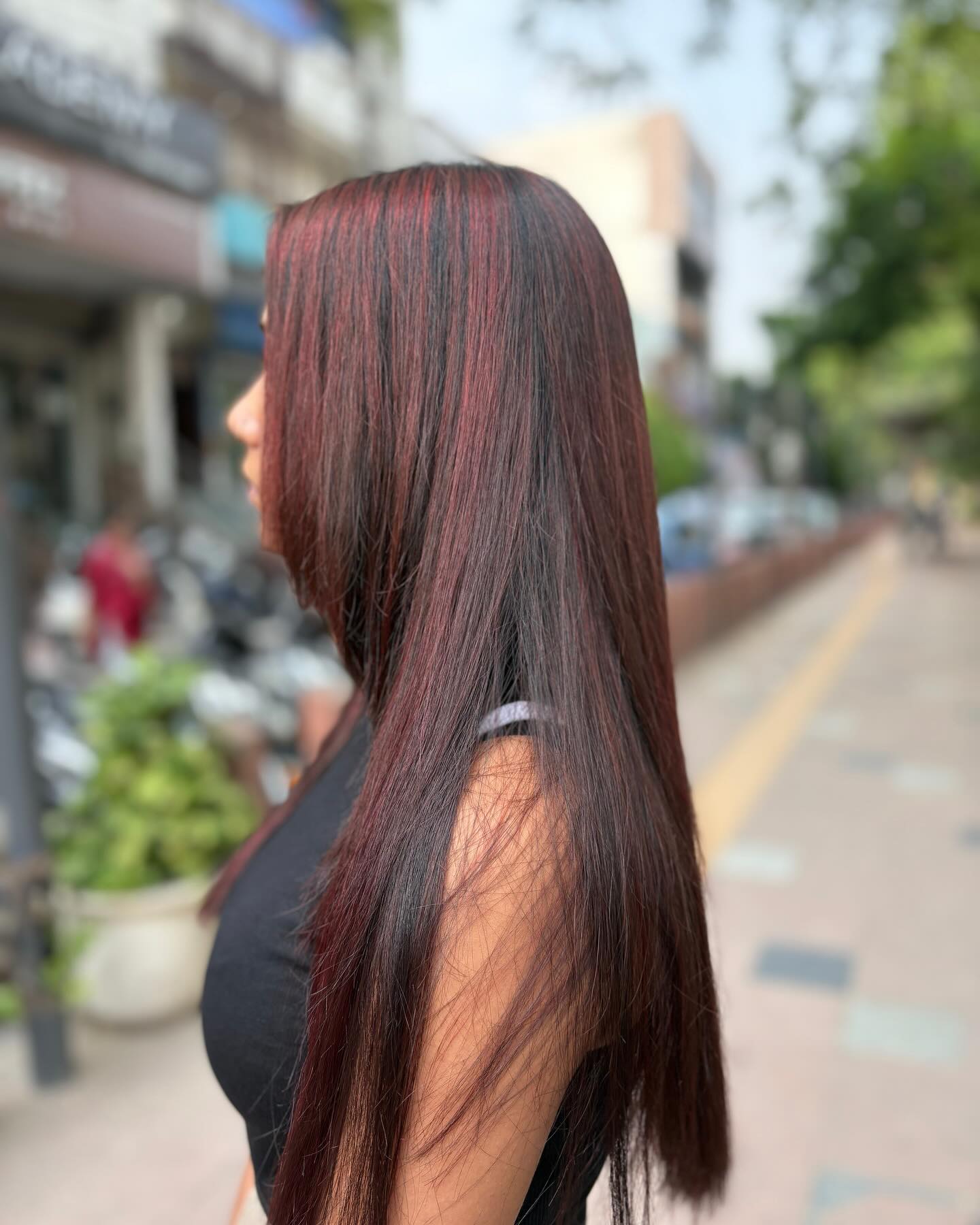 Elegant Long Straight Hair with Striking Red Highlights