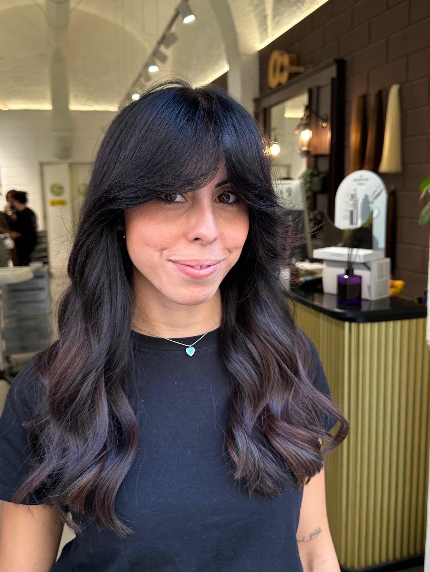 Elegant Raven Waves with Face-Framing Bangs