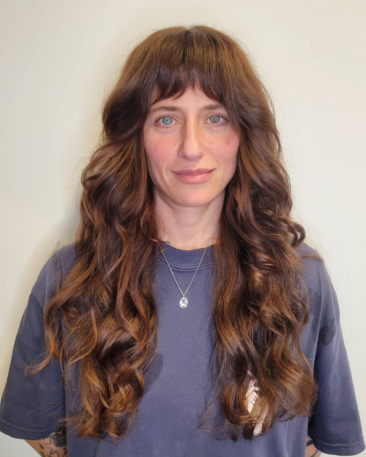 Flowing Chestnut Waves with Defined Curtain Bangs