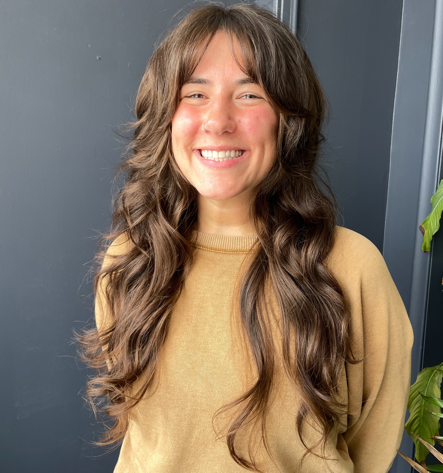 Rich Caramel Waves with Airy Curtain Bangs