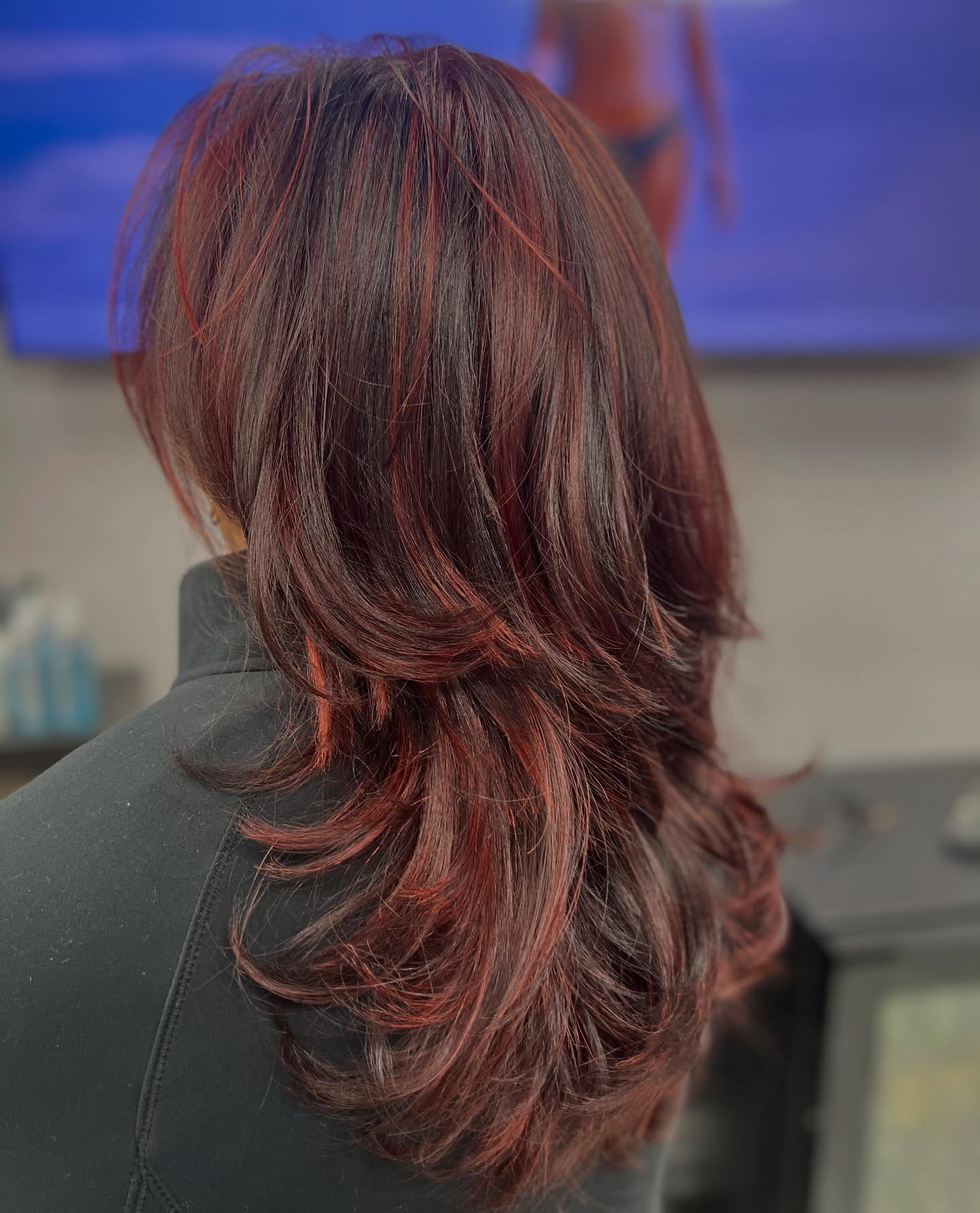 Stylish Layered Cut with Vibrant Auburn Highlights