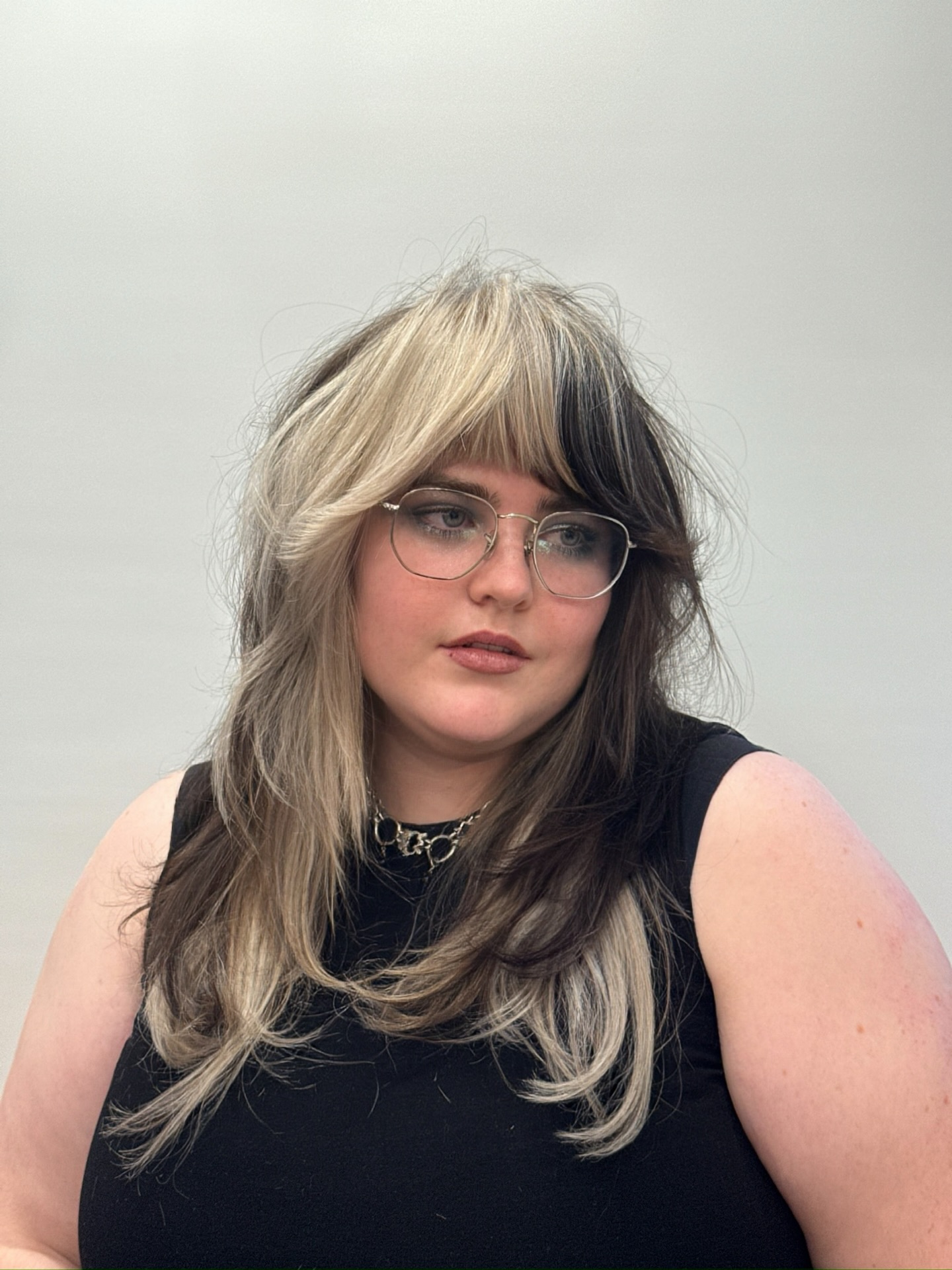 Chic Black and Blonde Balayage with Feathered Bangs