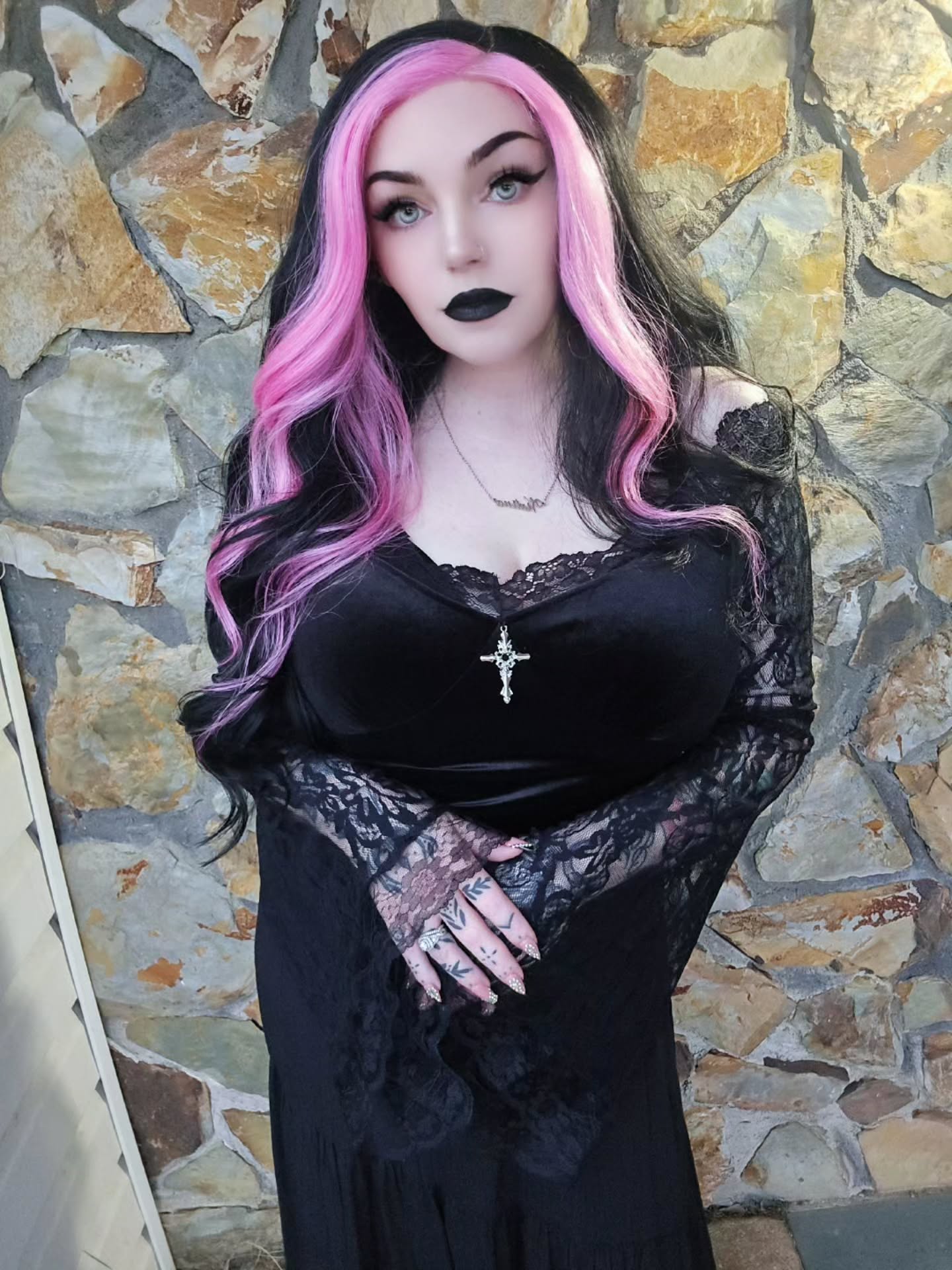 Striking Pink Streaks on Glossy Black Waves