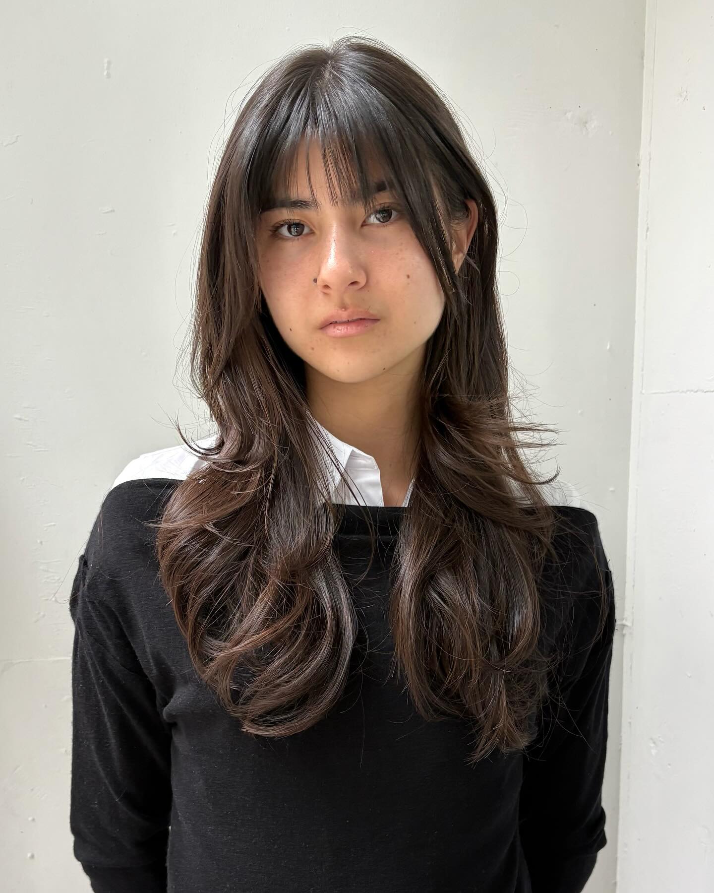 Chic Layered Cut with Soft Wispy Bangs