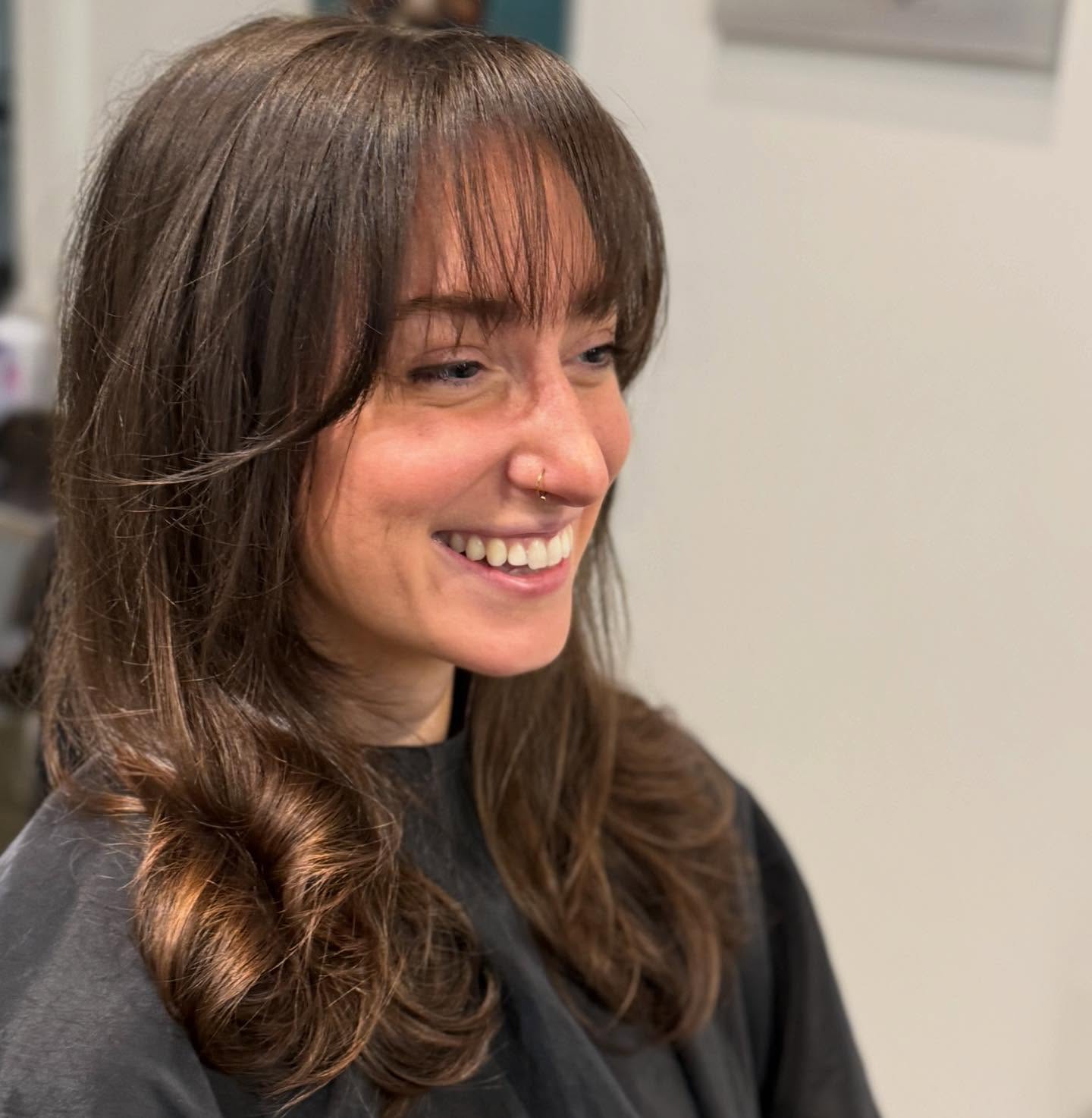 Chic Wispy Bangs with Soft Layered Curls