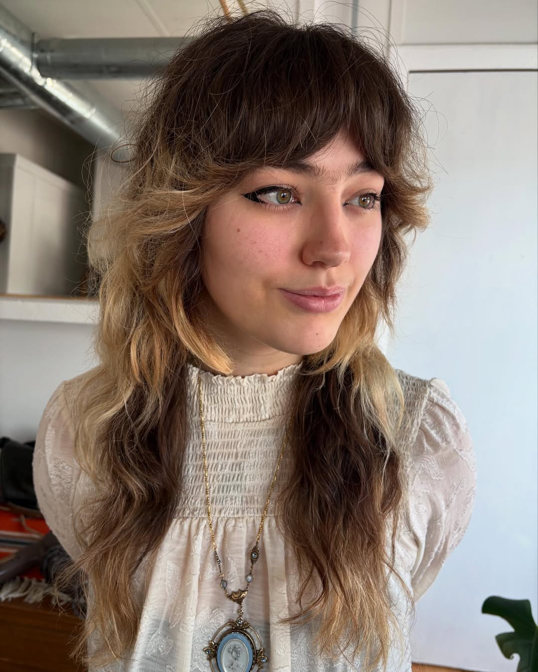 Bohemian Brunette-to-Blonde Ombre with Soft Bangs