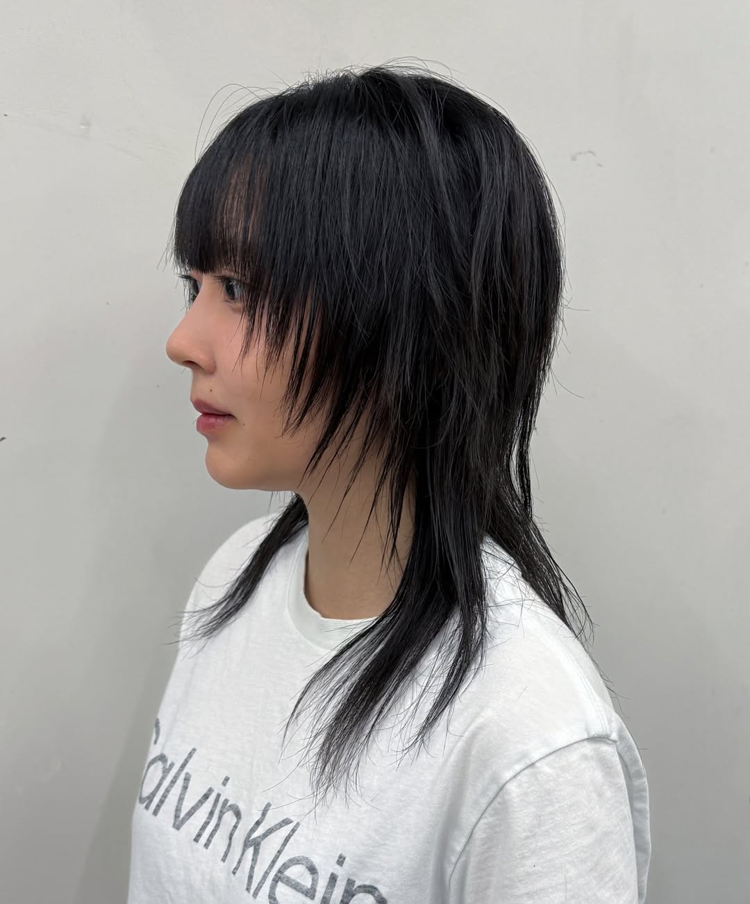Edgy Black Wolf Cut with Choppy Bangs