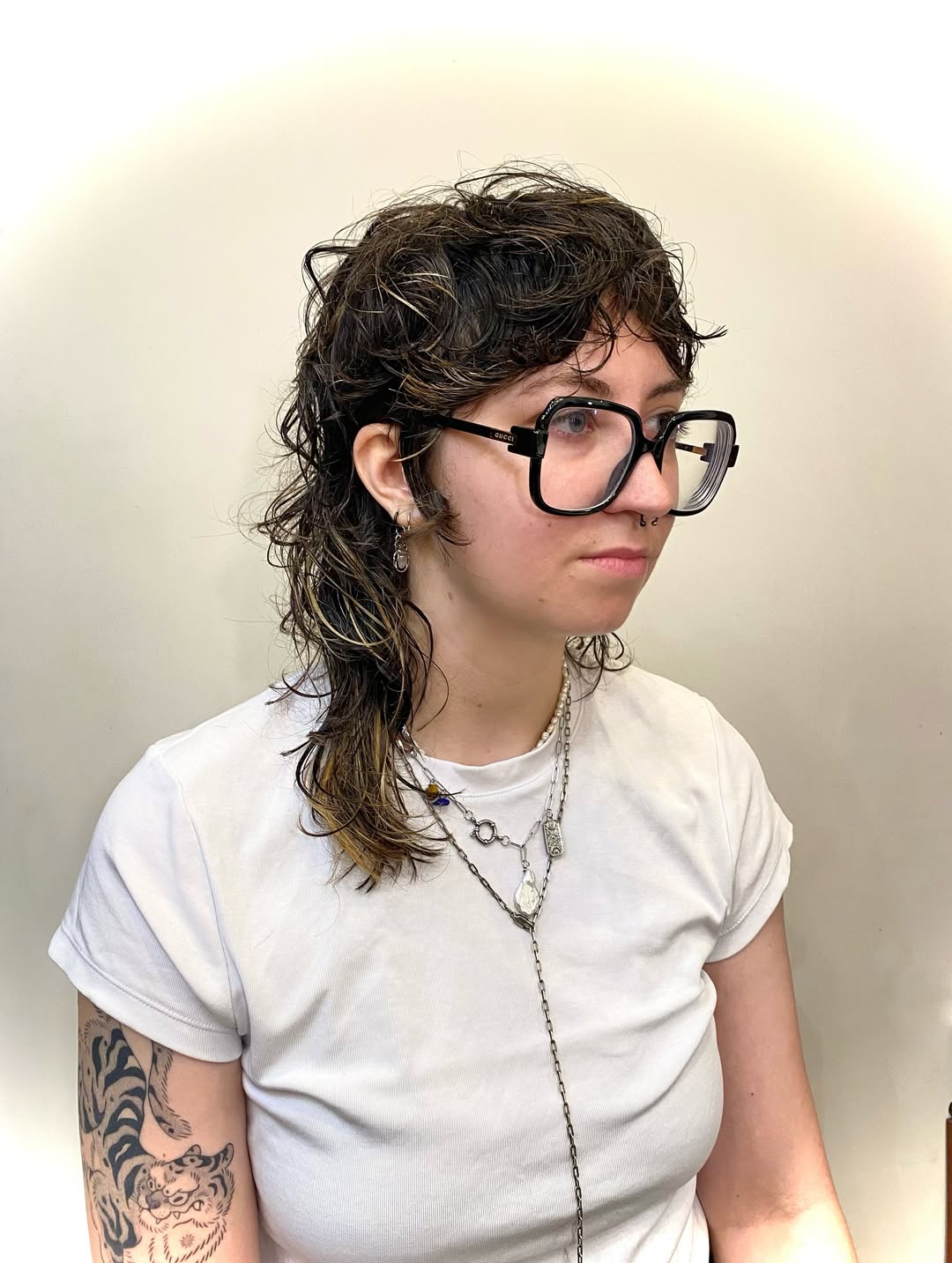 Edgy Medium-Length Curly Shag with Subtle Highlights
