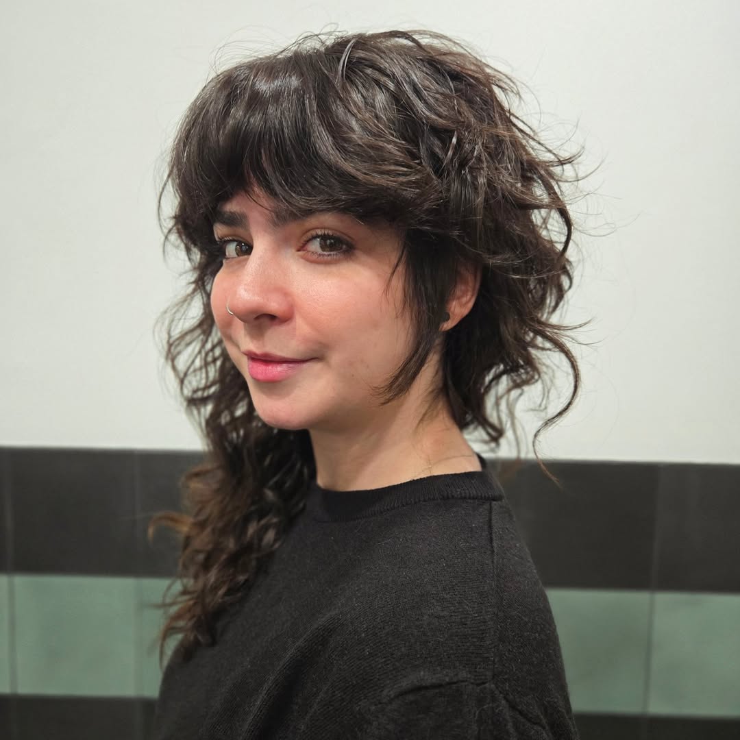Effortlessly Tousled Brunette Shag with Bangs