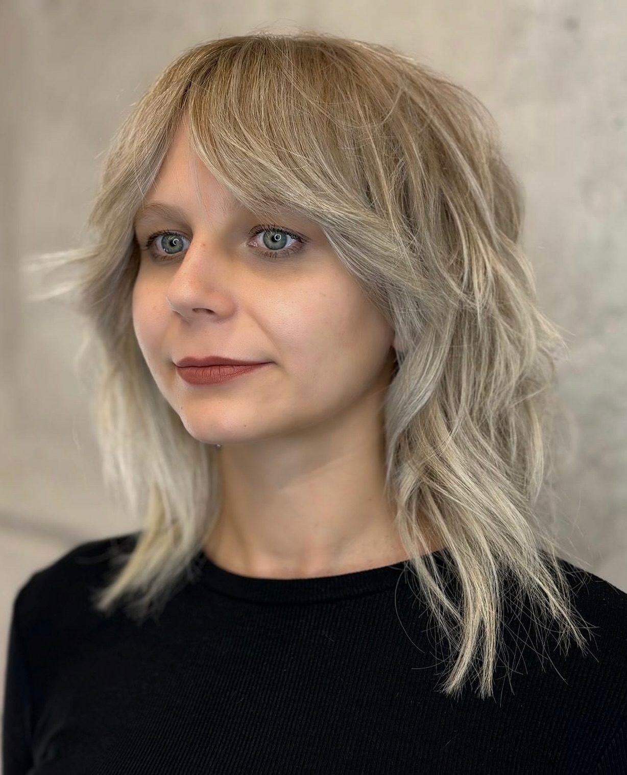 Feathered Ash Blonde Wolf Cut with Soft Bangs