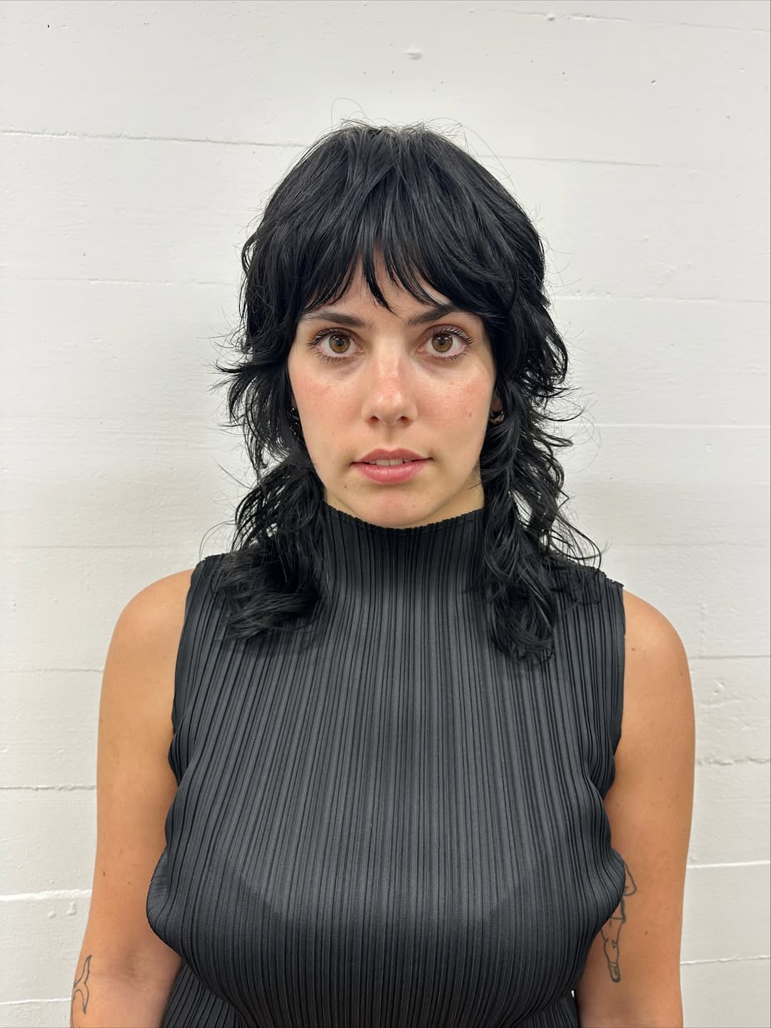 Jet-Black Cascading Curls with Curtain Bangs