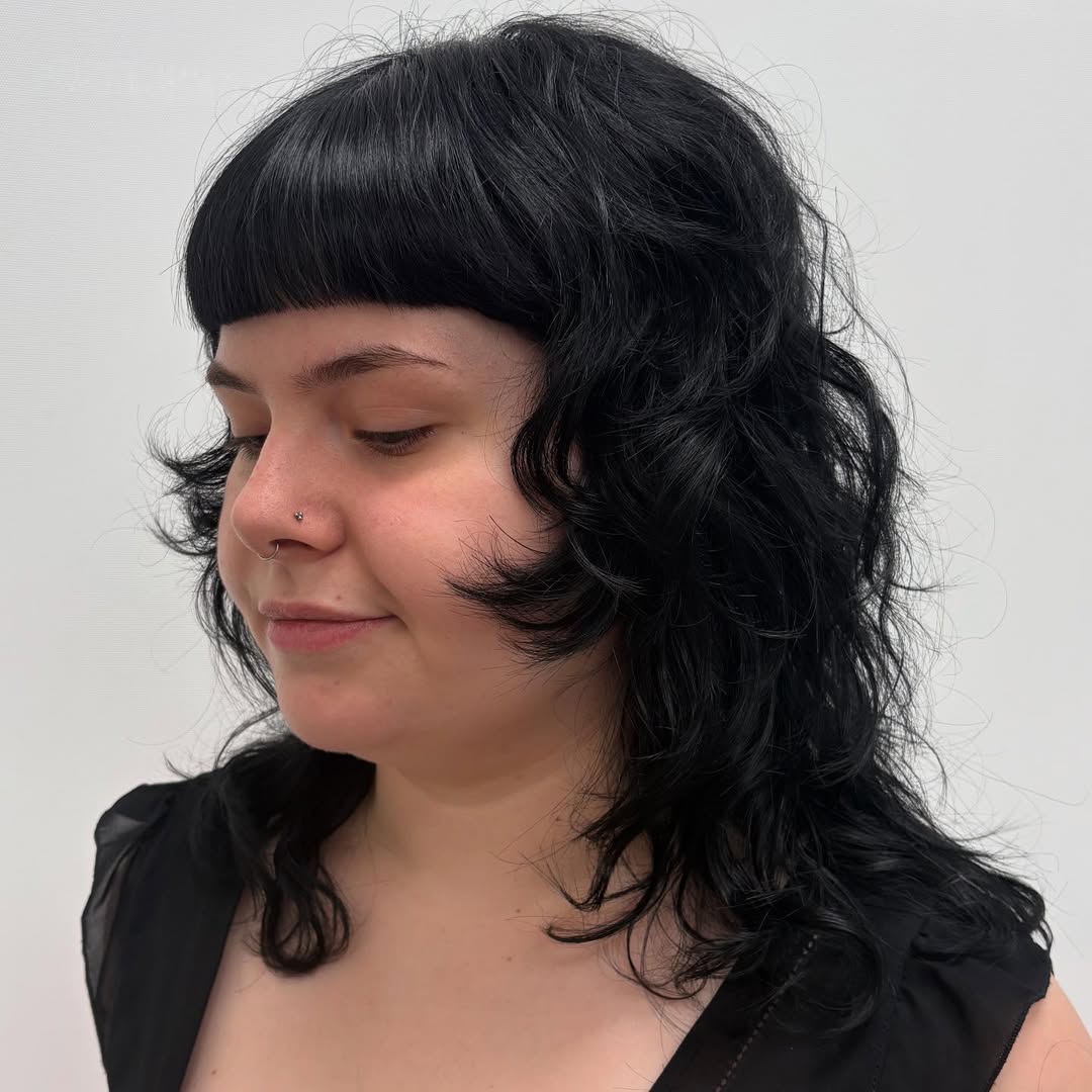 Jet-Black Medium S-Curl Layers with Bold Blunt Bangs