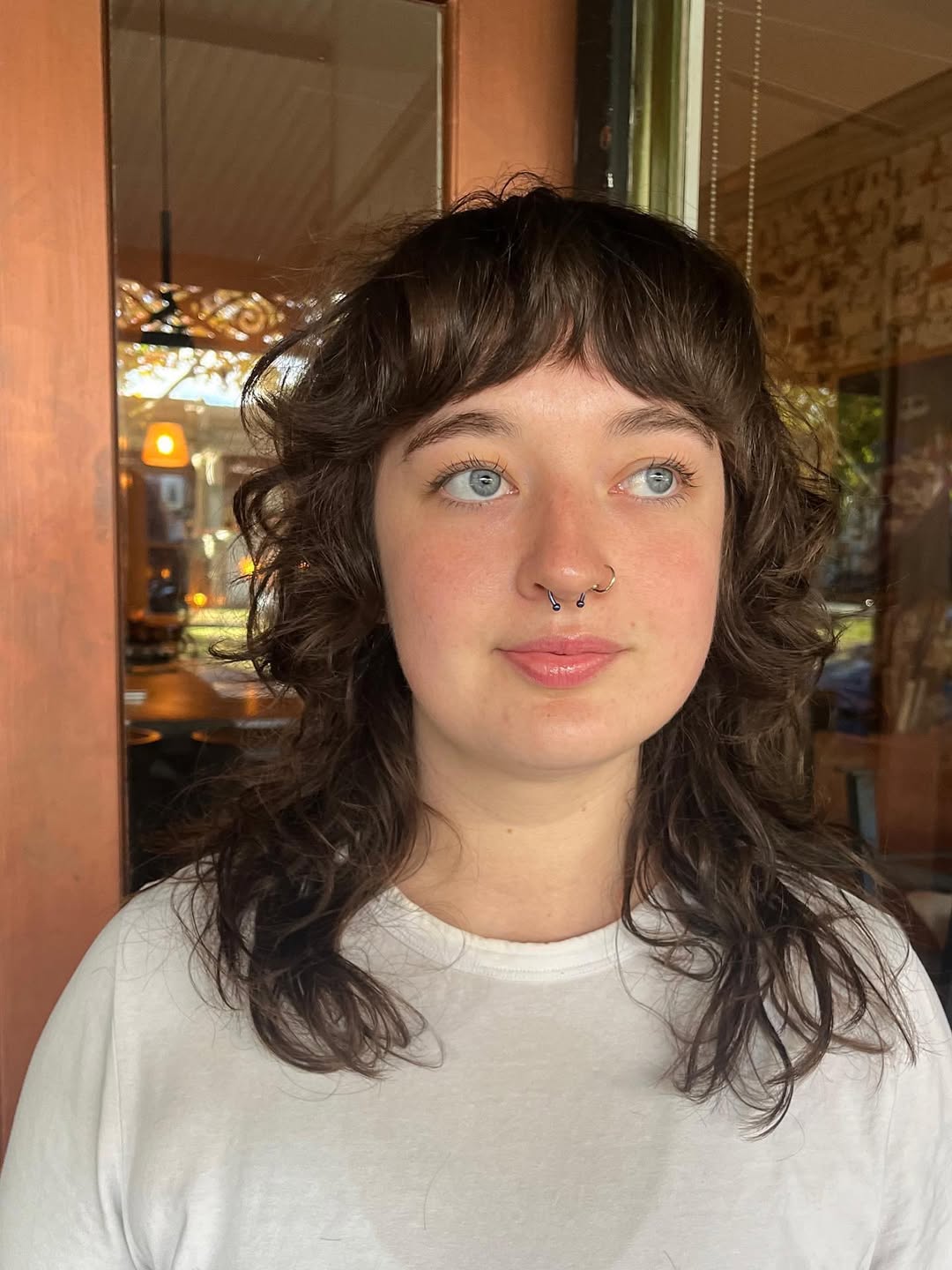 Playful Curls with Soft Curtain Bangs
