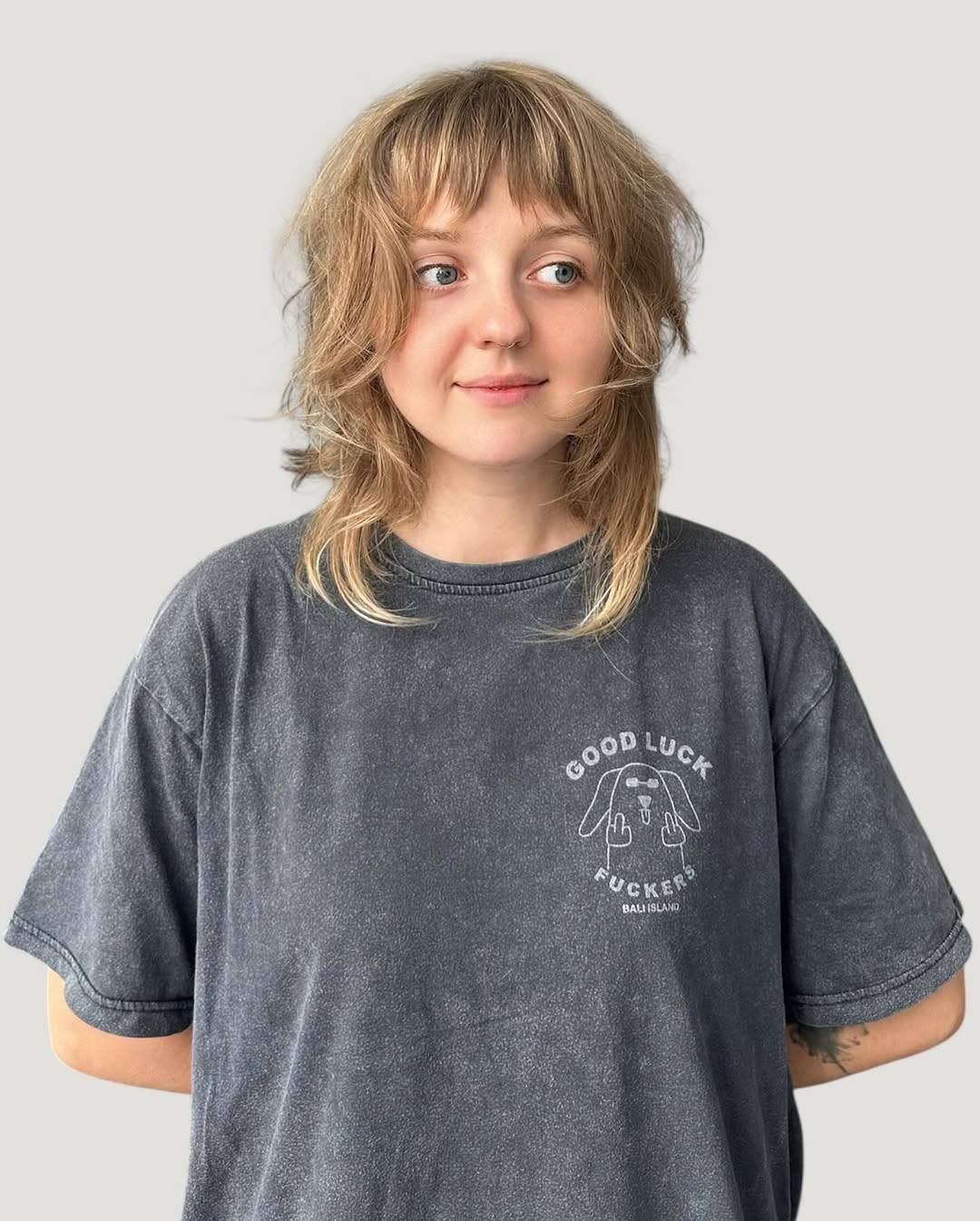 Playfully Tousled Mid-Length Wolf Shag with Blonde Highlights