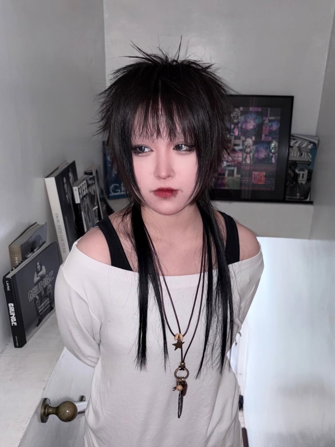 Rebellious Jet-Black Spiked Shag with Long Wispy Bangs