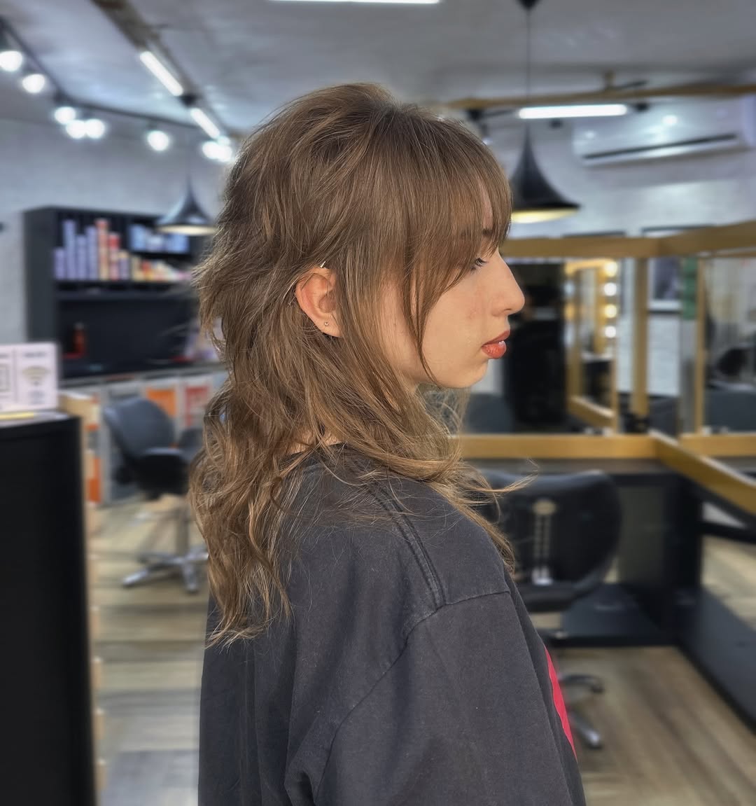 Sleek Tawny Wolf Cut with Subtle Waves