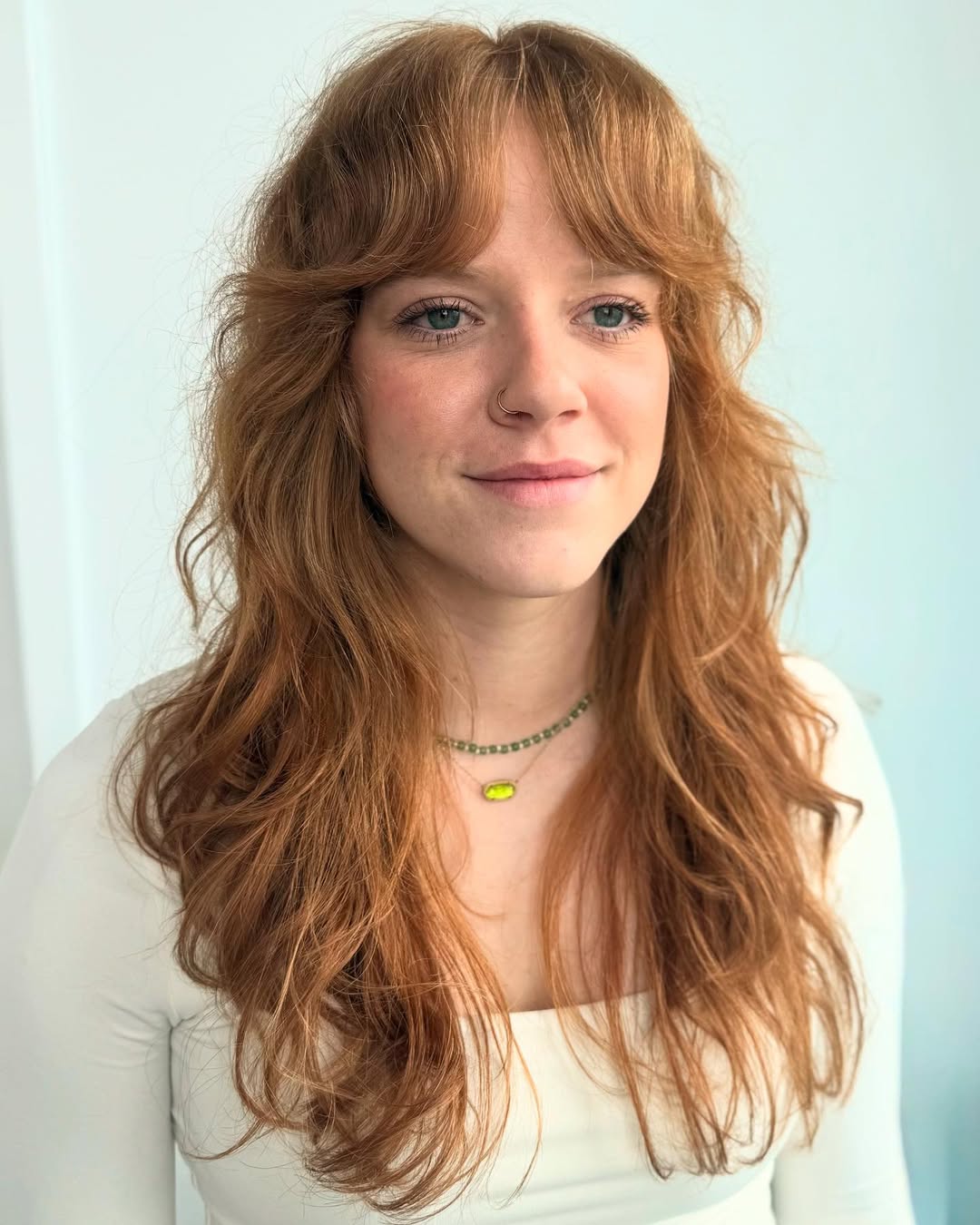 Soft Auburn Waves with Curtain Bangs