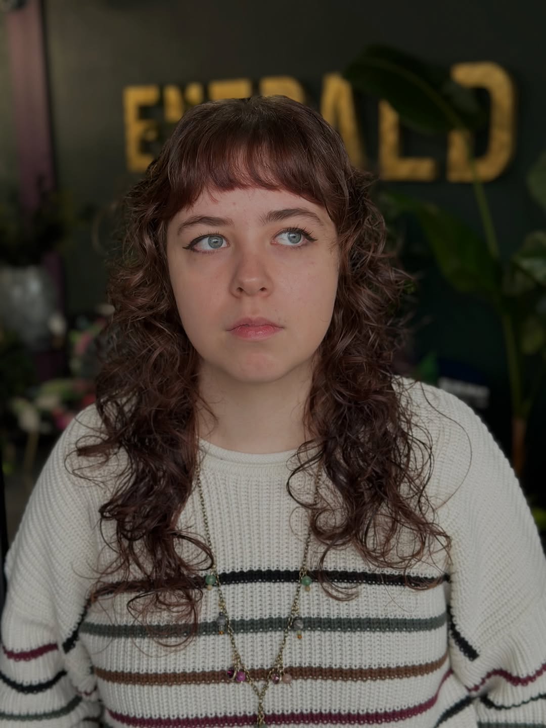 Softly Contoured Chestnut Waves with Blunt Bangs