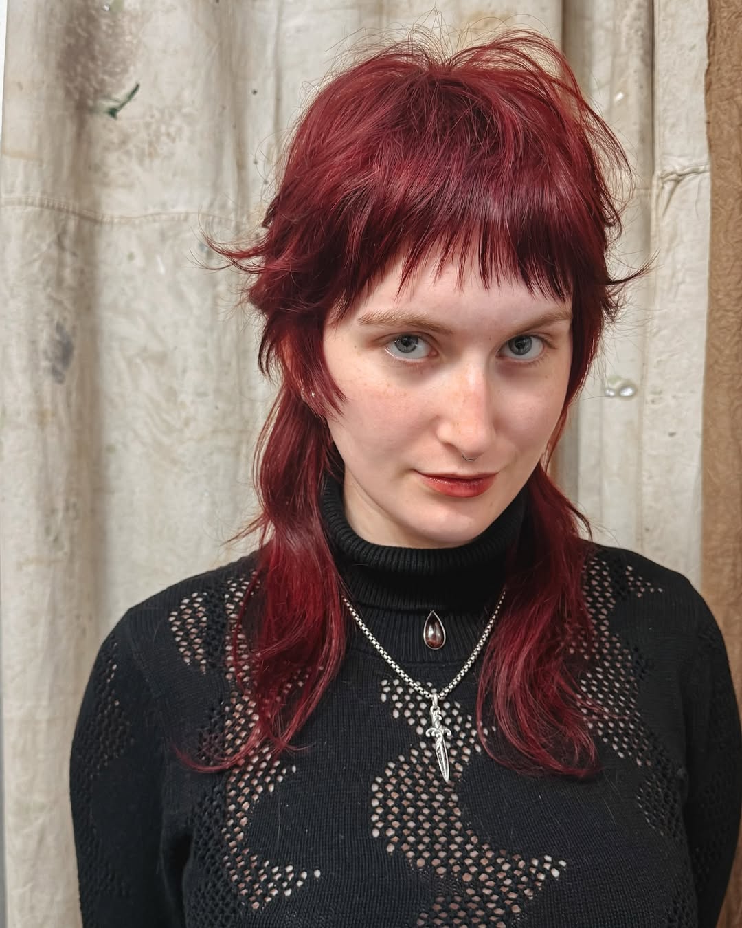 Vibrant Crimson Tousled Bob with Choppy Bangs