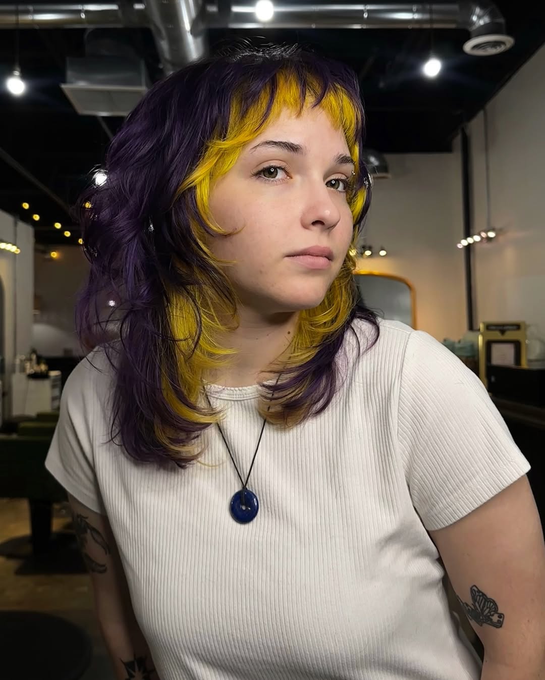 Vibrant Purple and Yellow Layered Shag with Blunt Bangs