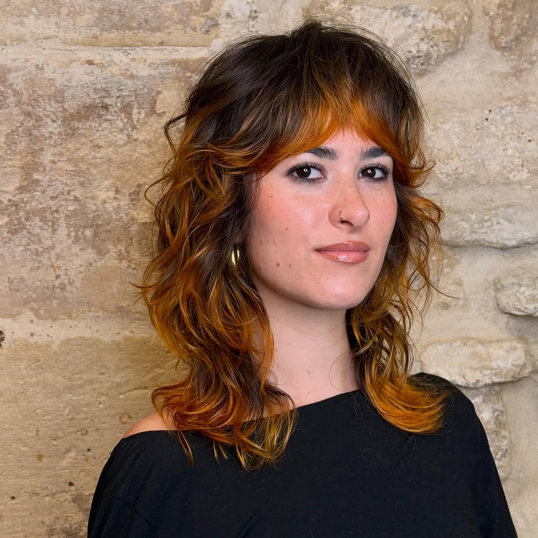 Vibrant Sunset Shag with Bold Curtain Bangs