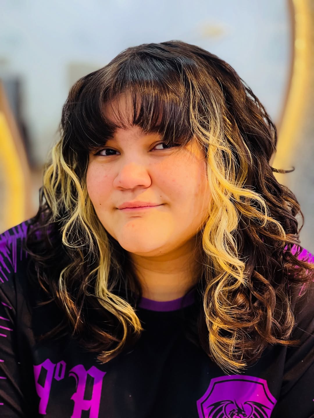 Brunette-to-Blonde Ombre Curls with Full Bangs