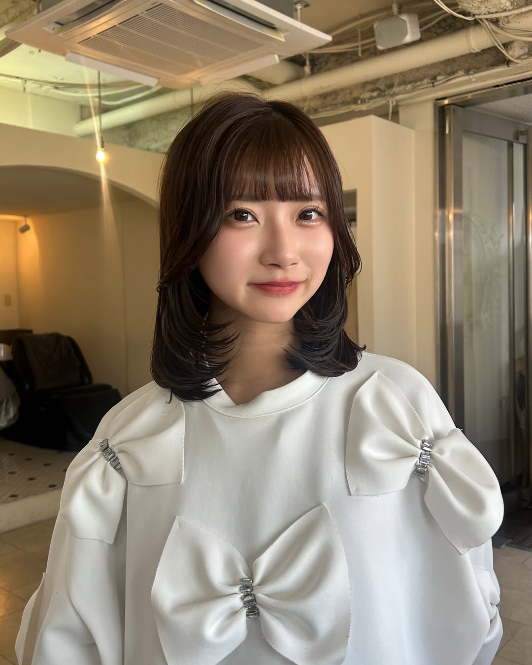 Chic Brunette Bob with Flipped Ends and Soft Bangs