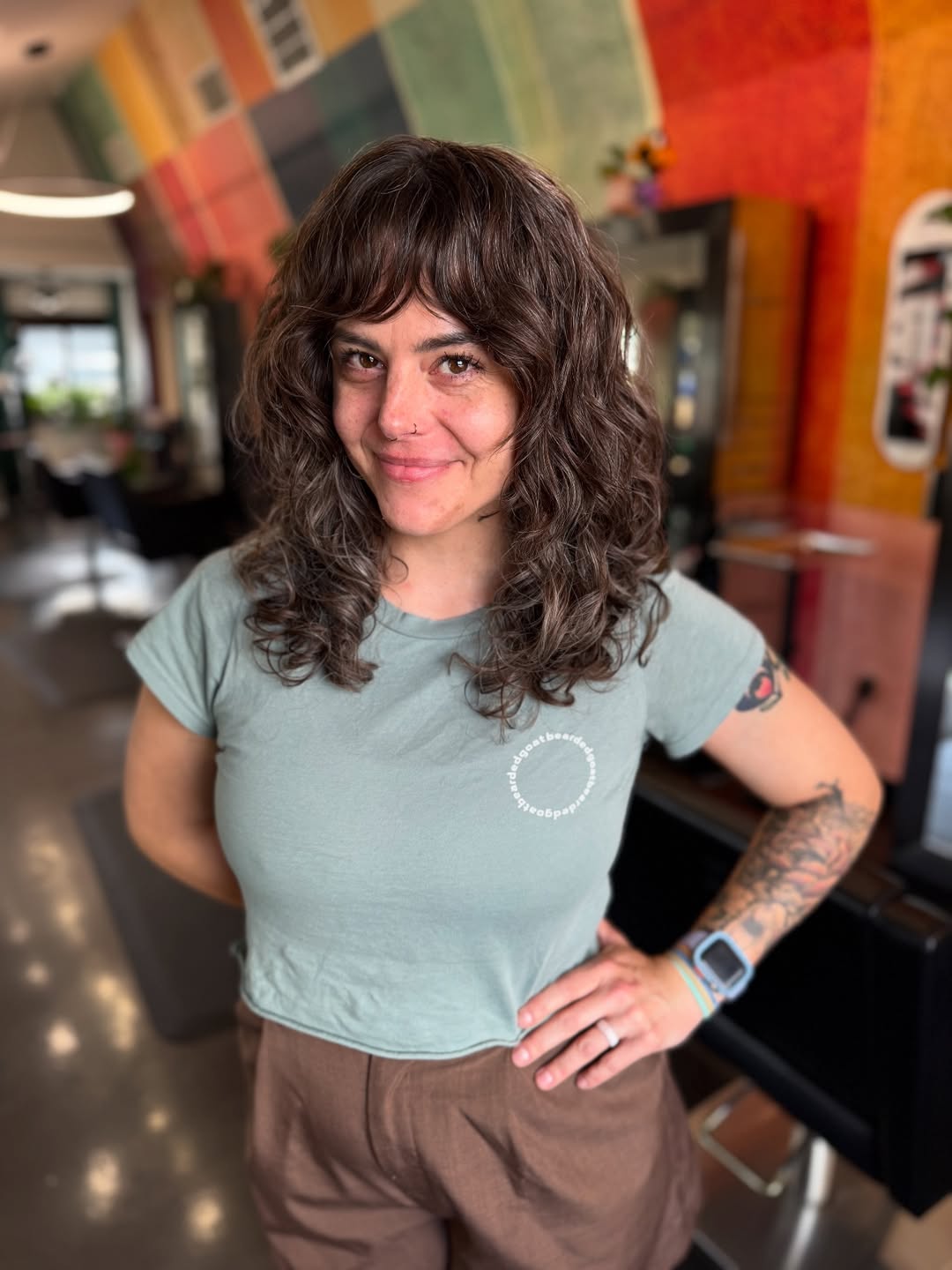 Effortless Chestnut Curls with Face-Framing Bangs