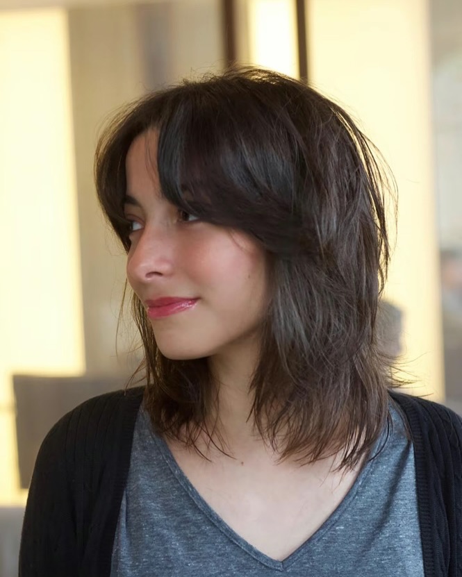 Effortlessly Tousled Brunette Shag with Side Fringe