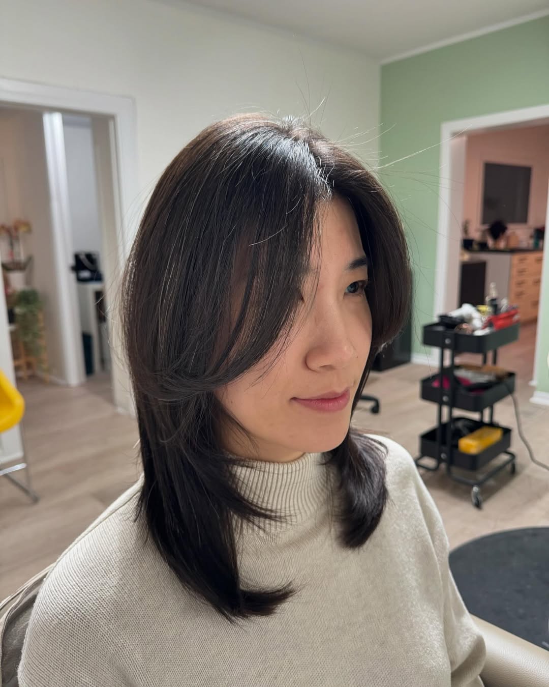 Elegant Charcoal Layered Bob with Side-Swept Fringe