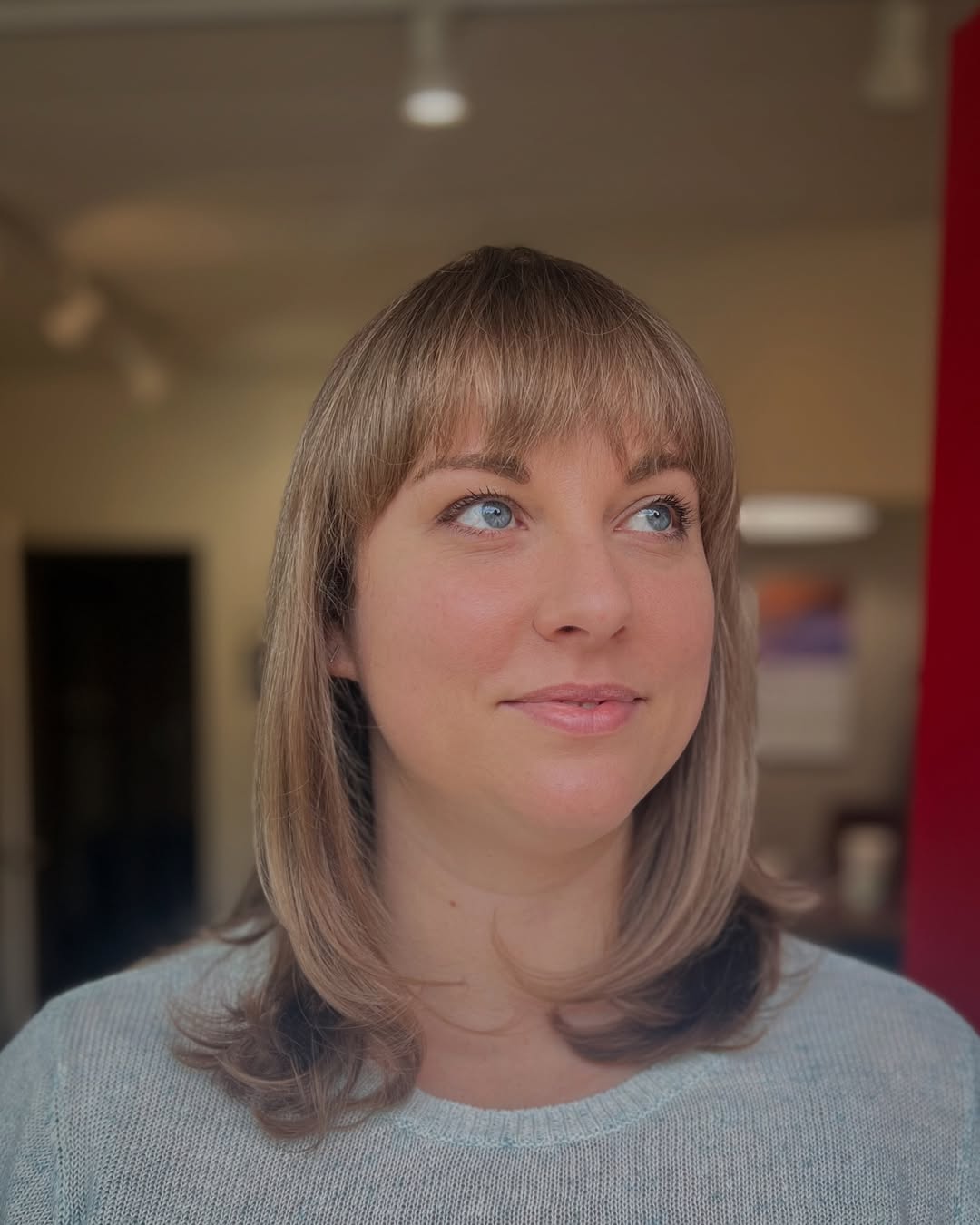 Subtly Layered Beige Blonde Bob with Wispy Bangs