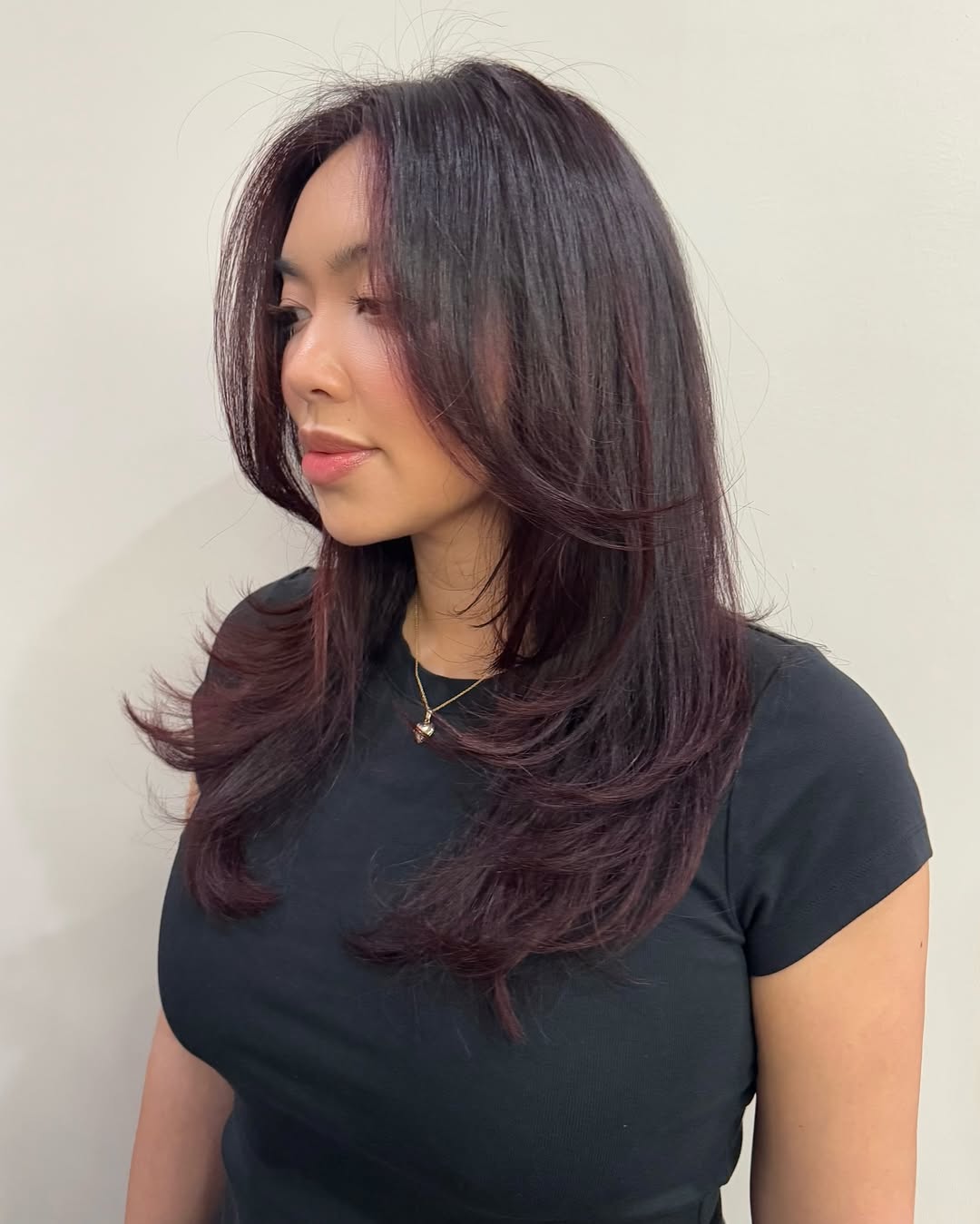Velvety Burgundy Layers with Soft Side-Swept Bangs