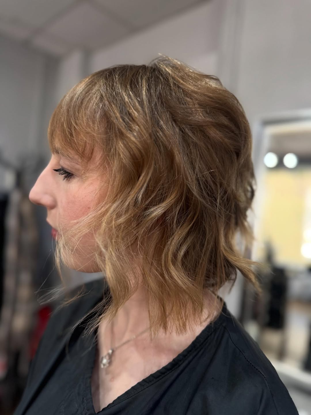 Whimsical Wavy Tousled Bob with Bangs