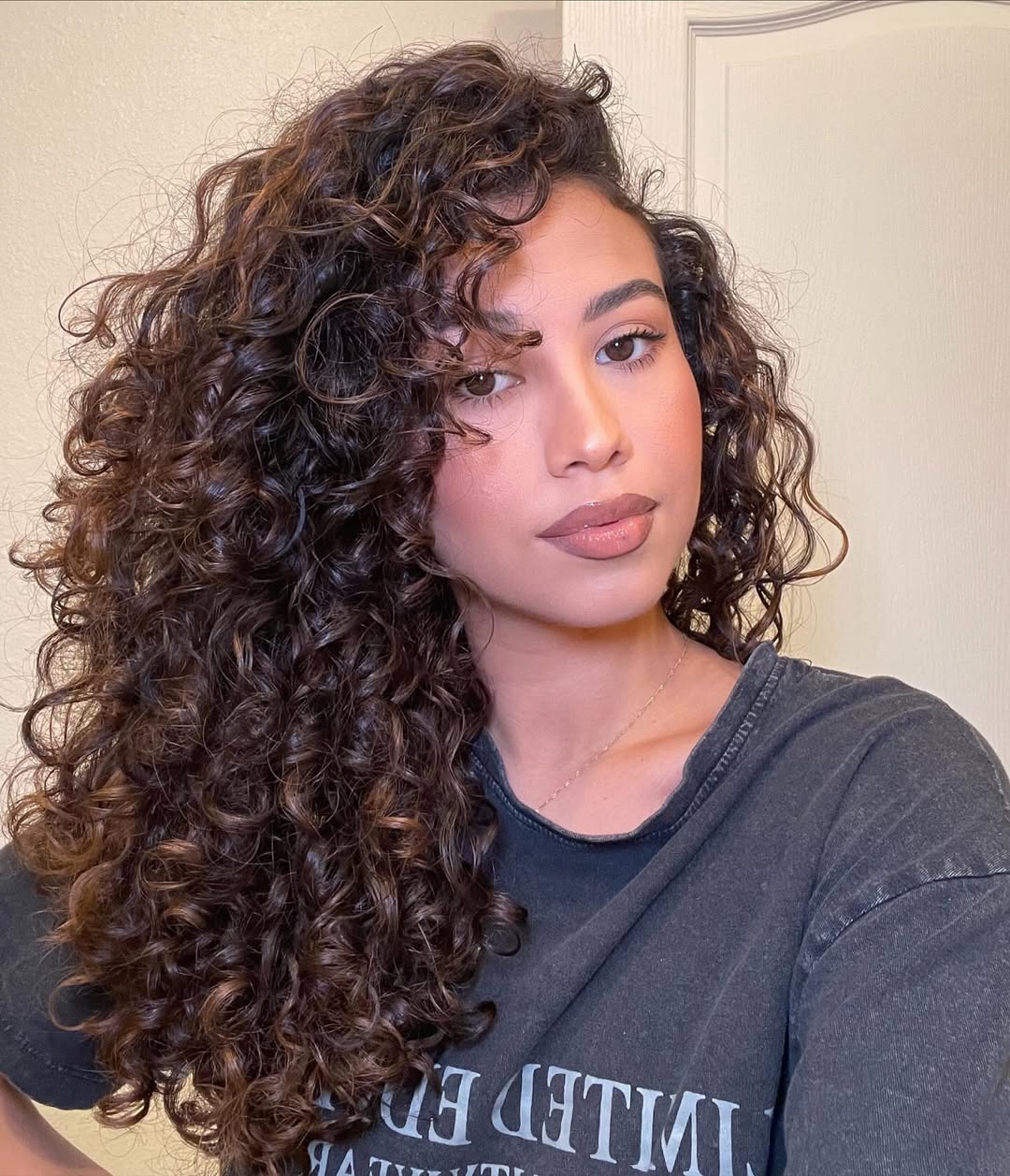Luxurious Deep Chestnut Curls with Natural Volume