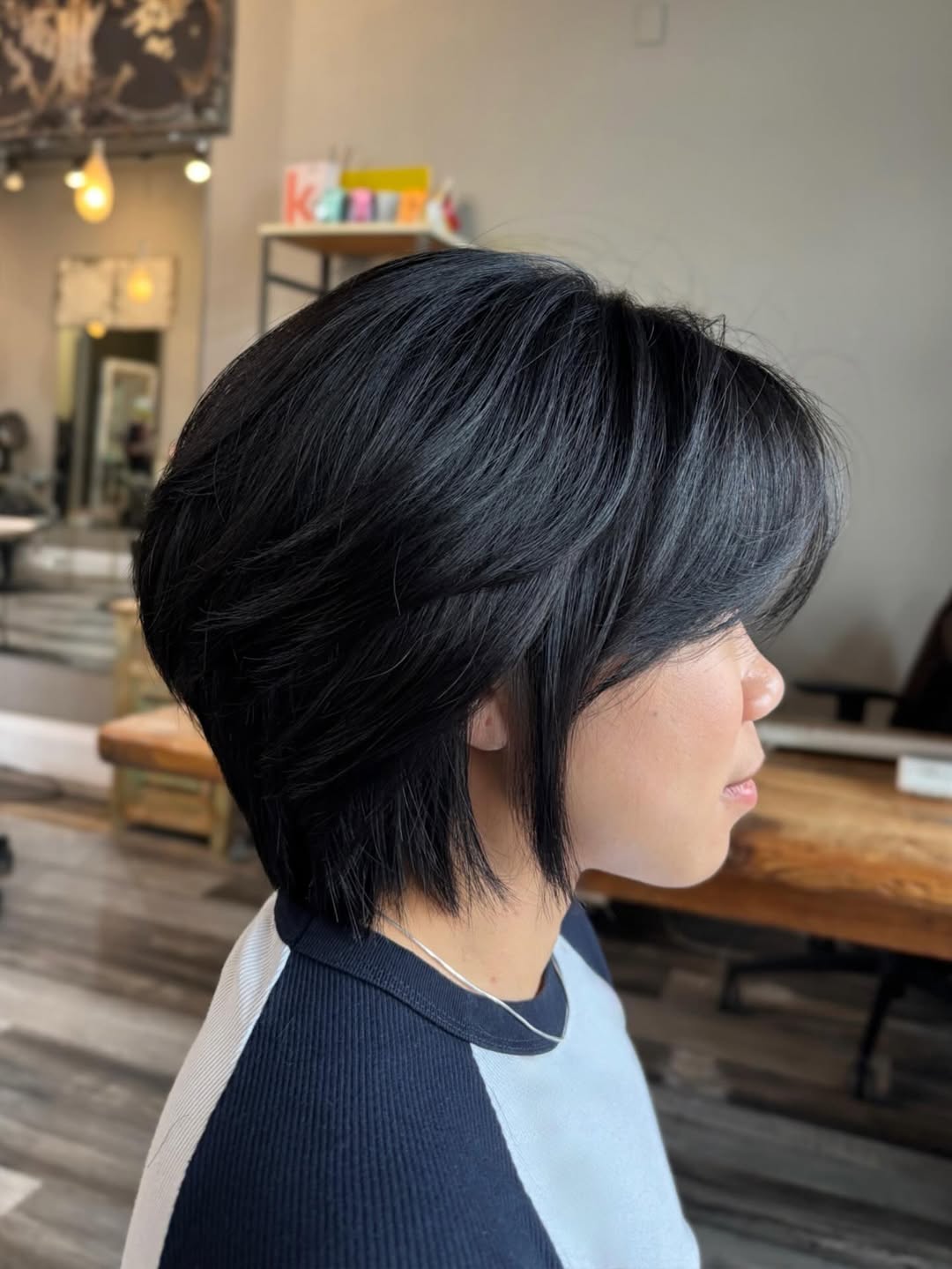 Striking Ebony Angled Bob with Side-Swept Fringe