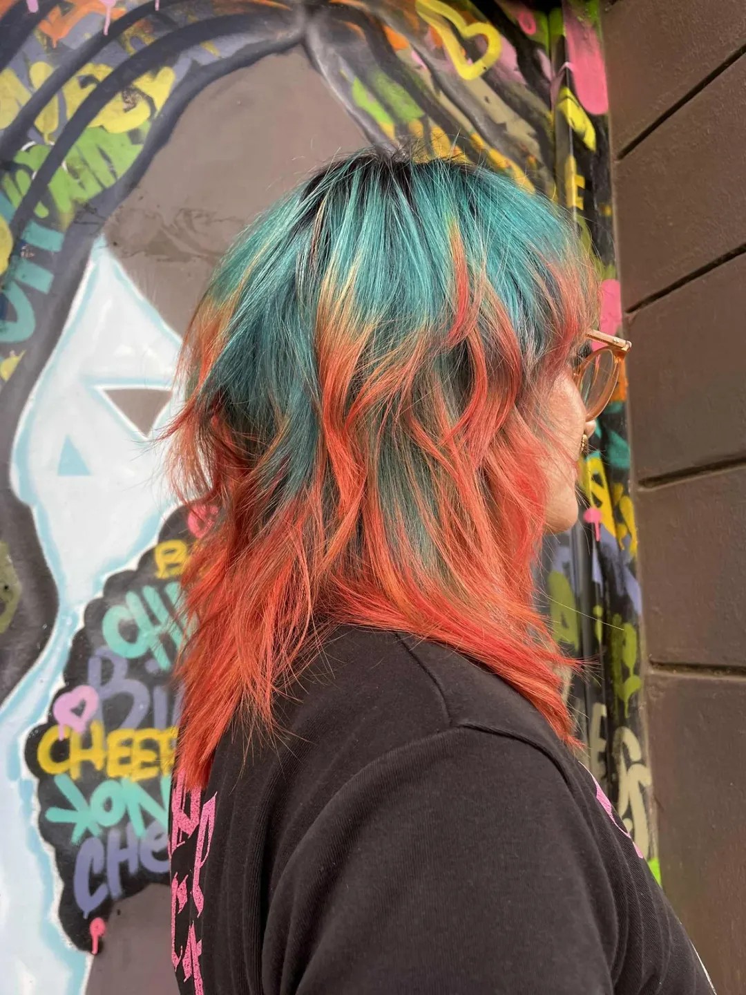 Teal-and-Coral Tousled Bob with Layers
