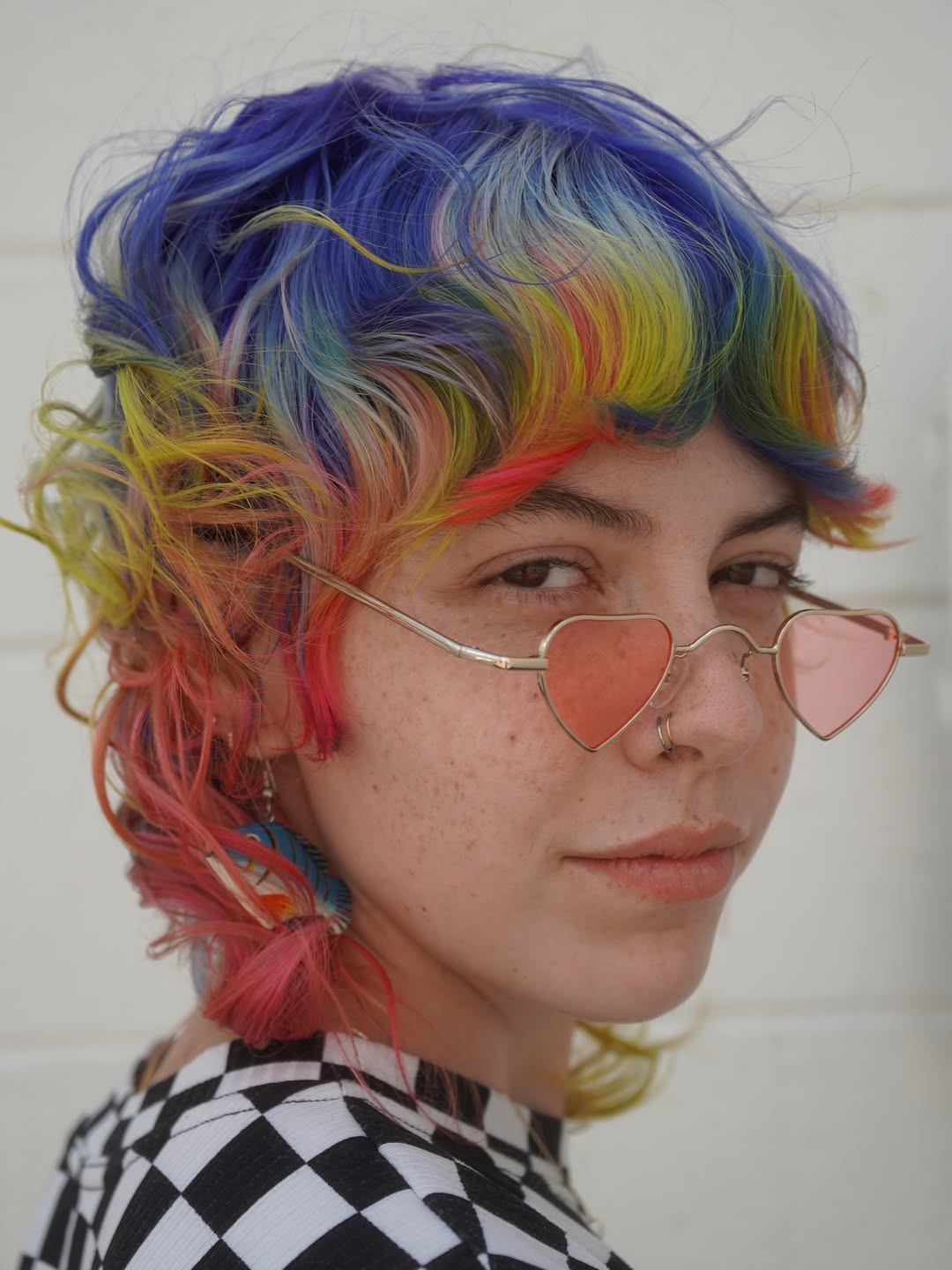 Vibrant Spectrum Ringlet Bob with Side-Swept Bangs