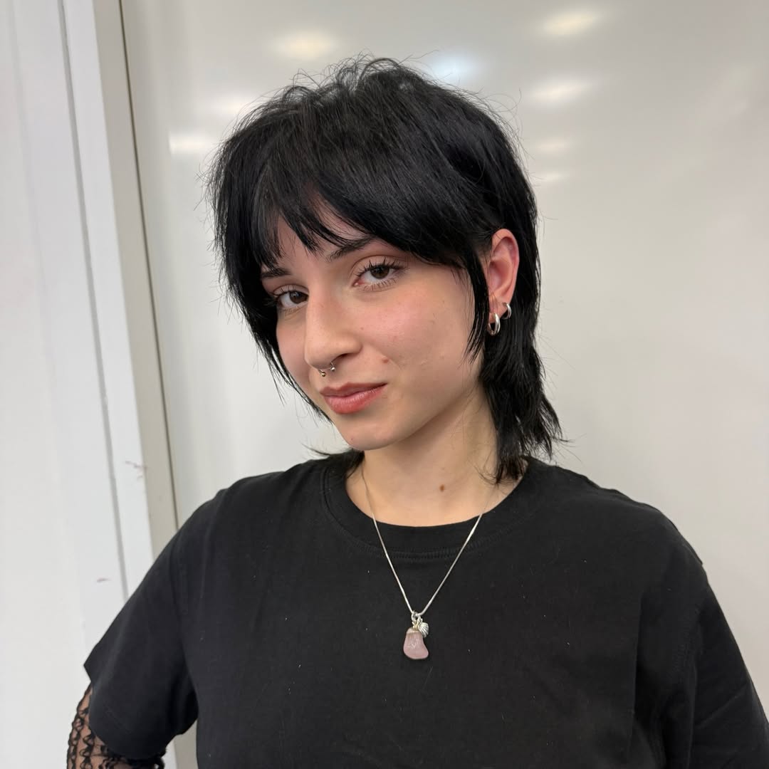 Edgy Black Textured Pixie with Wispy Bangs