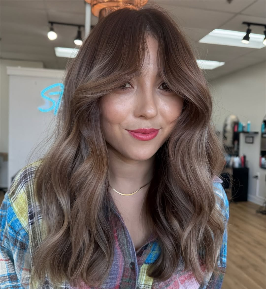 Effortless Cascading Bronde Waves with Curtain Bangs