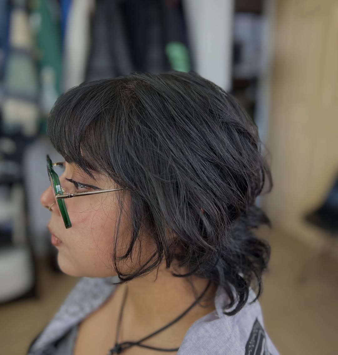 Effortless Charcoal Wavy Shag with Bangs