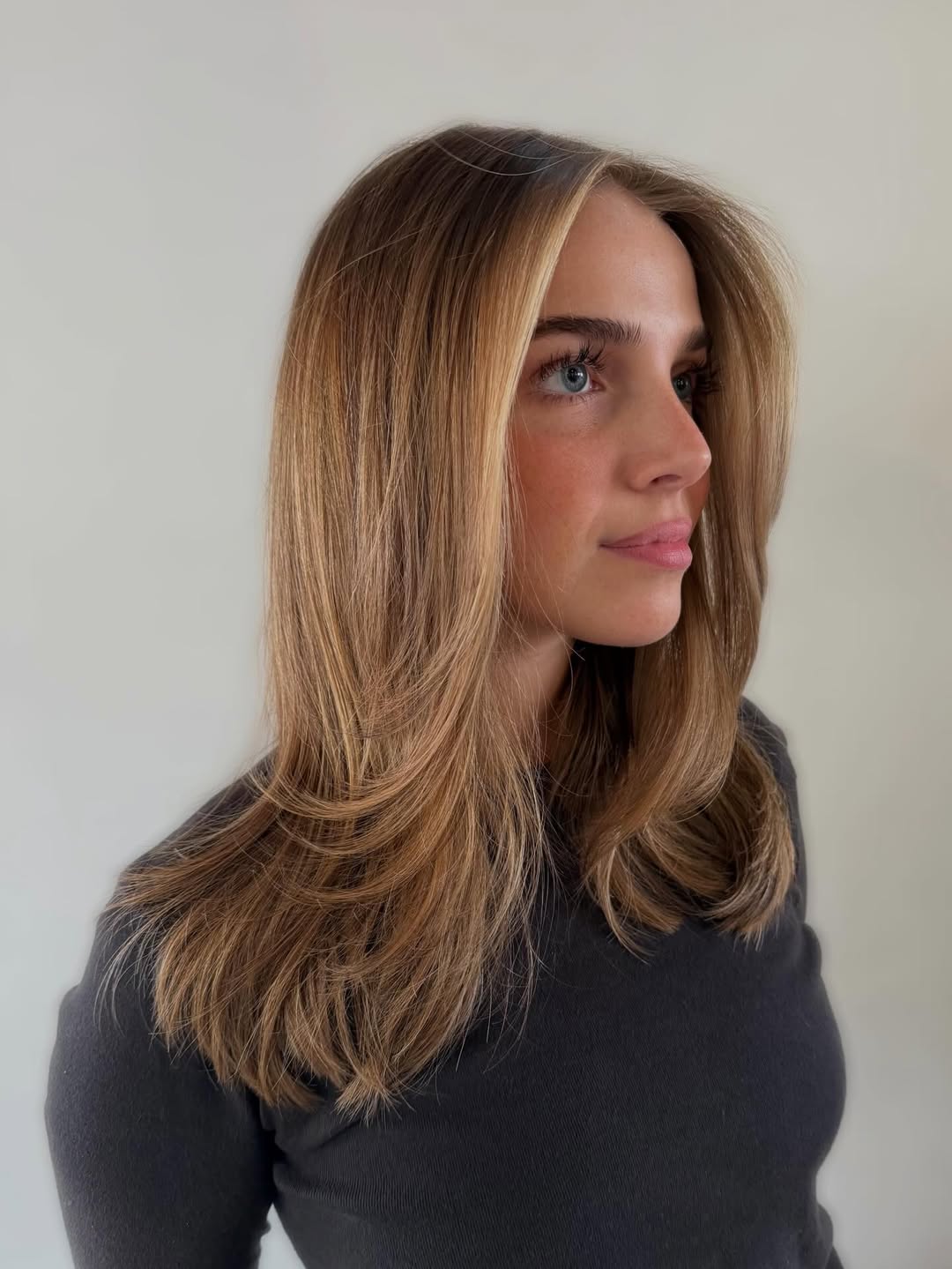 Flowing Bronde Layers with Subtle Face-Framing