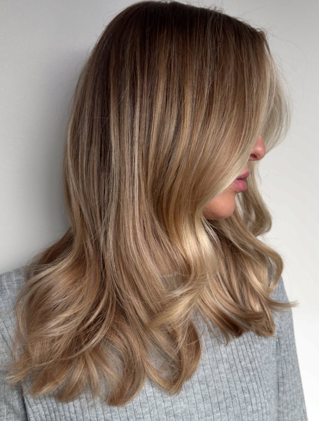 Striking Mid-Length Bronde with Delicate Waves