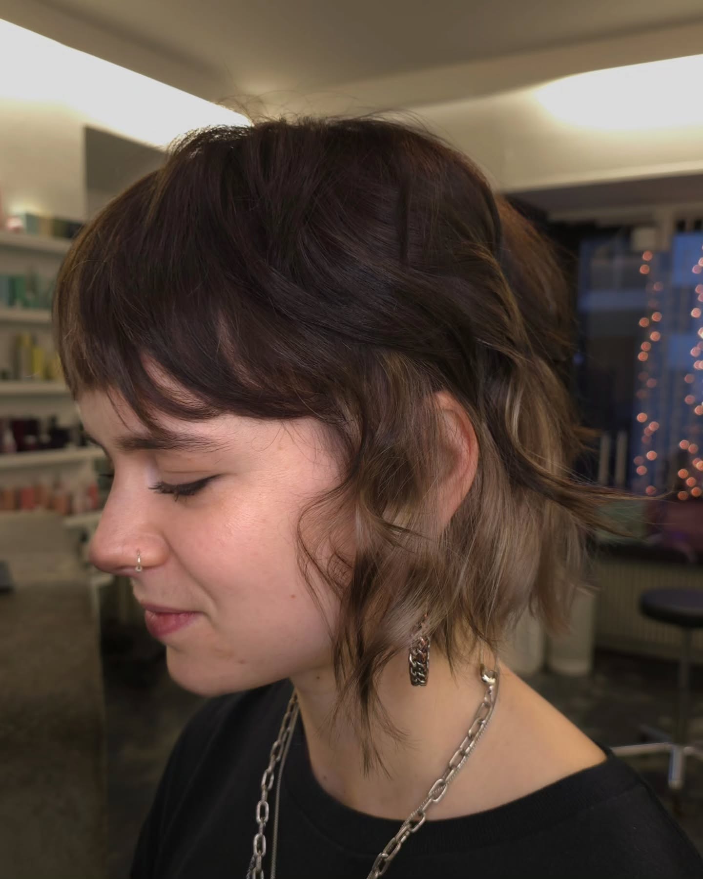 Deep Chestnut Wavy Bob with Side-Swept Bangs