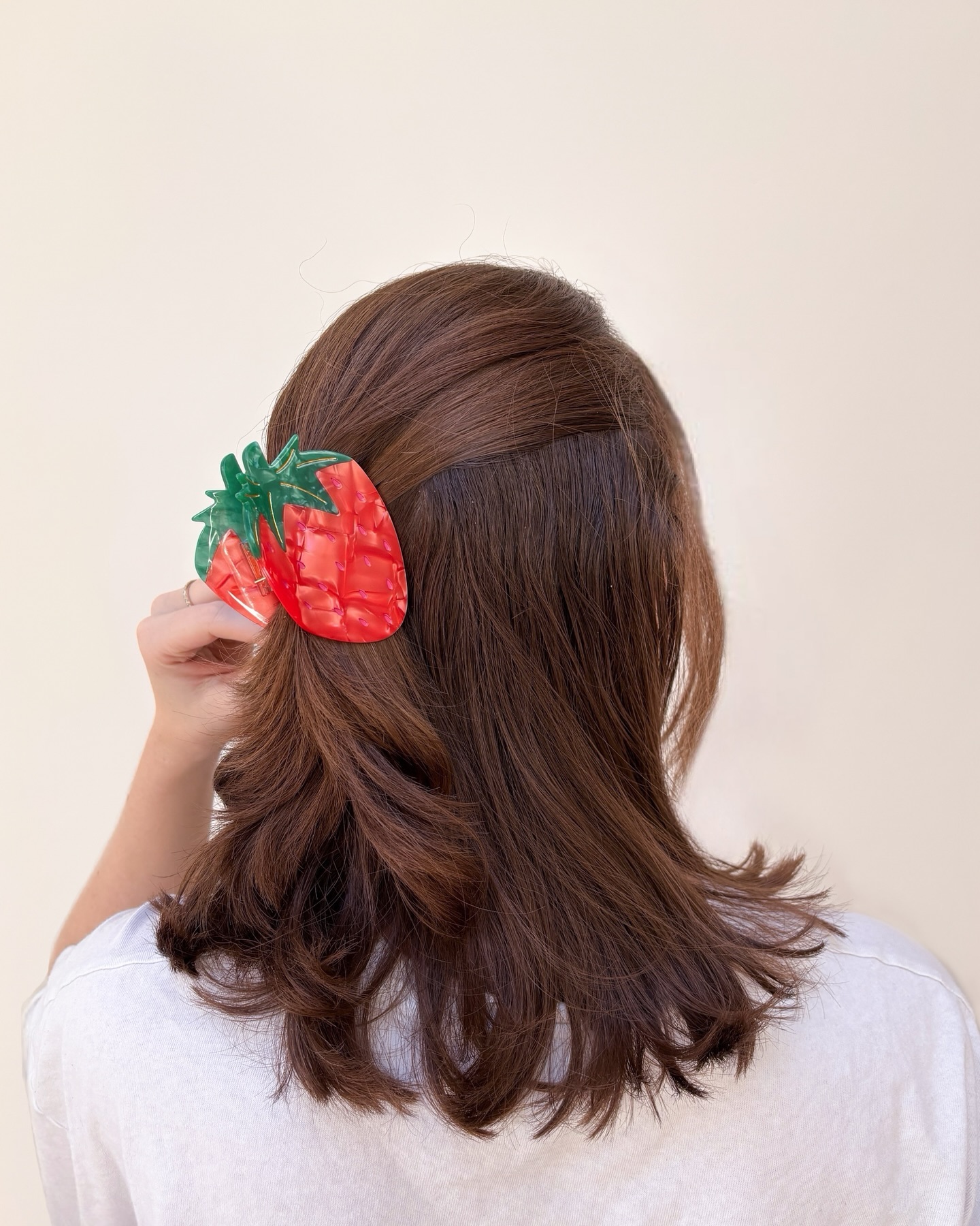 Layered Chestnut Waves with Playful Accessory