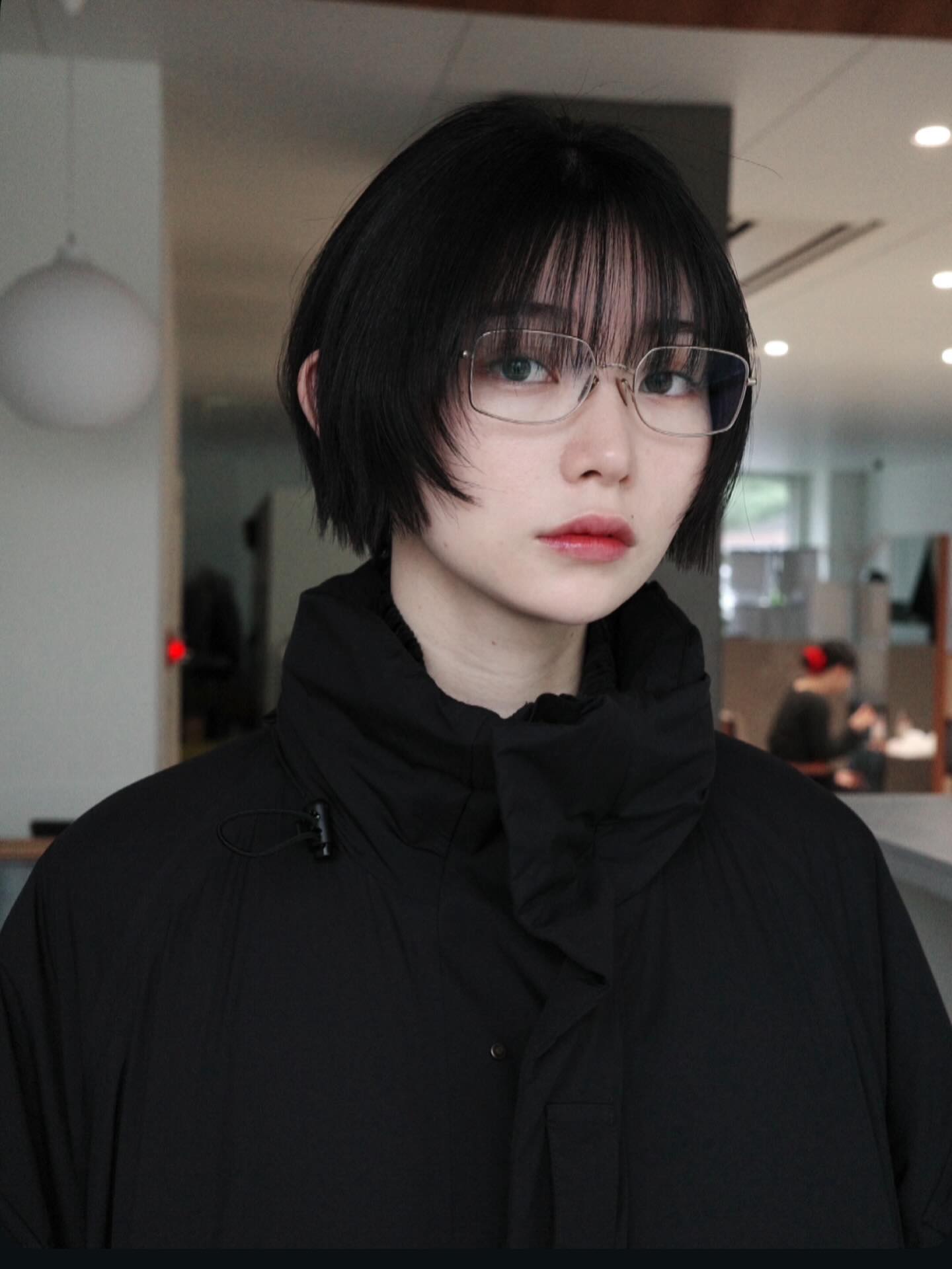 Modern Ebony Bob with Subtle Layers and Wispy Bangs