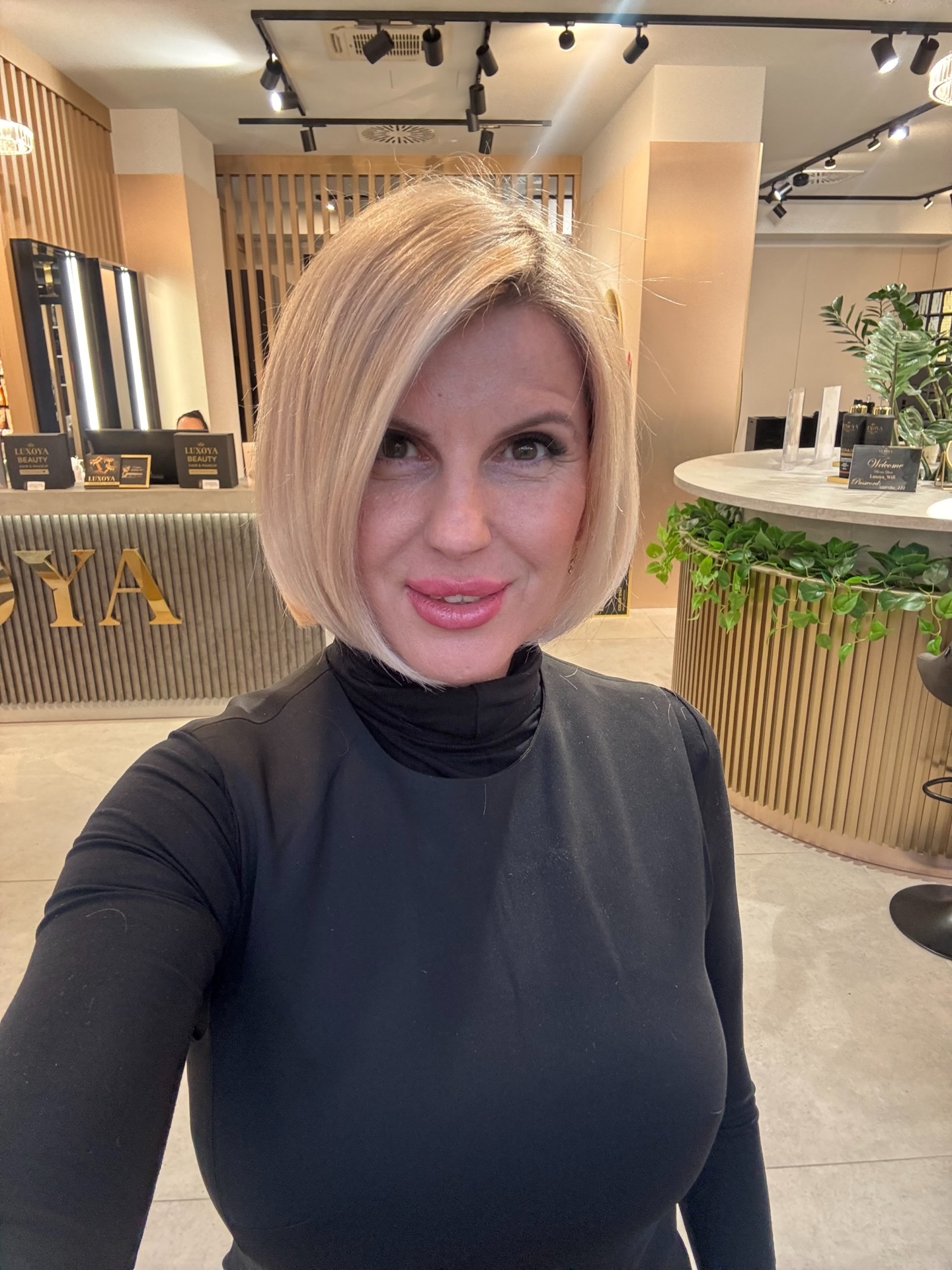 Sleek Blonde Angled Bob with Soft Volume