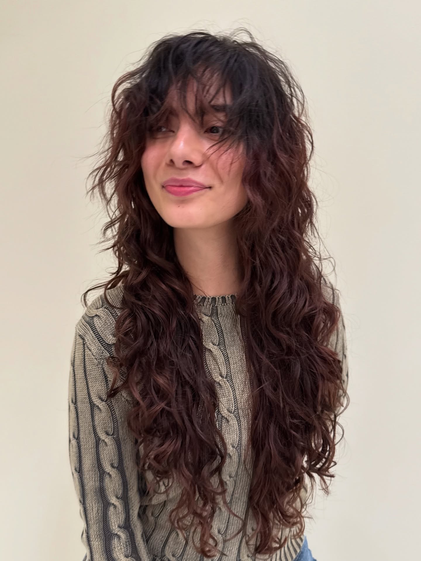 Whimsical Chestnut Curls with Feathered Fringe