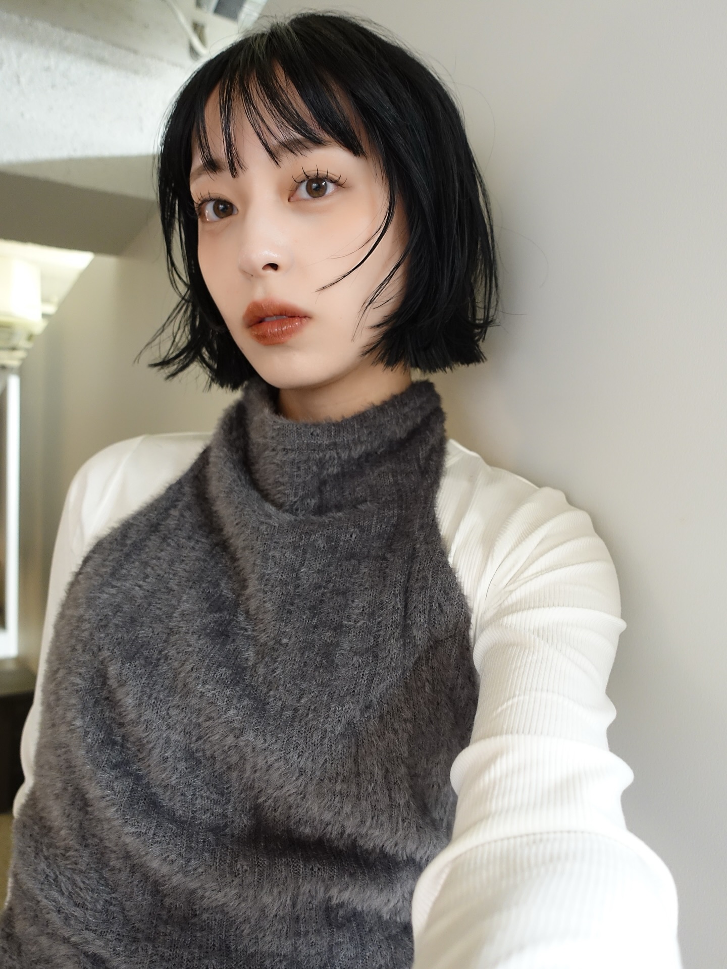 Chic Black Bob with Feathered Bangs and Textured Ends