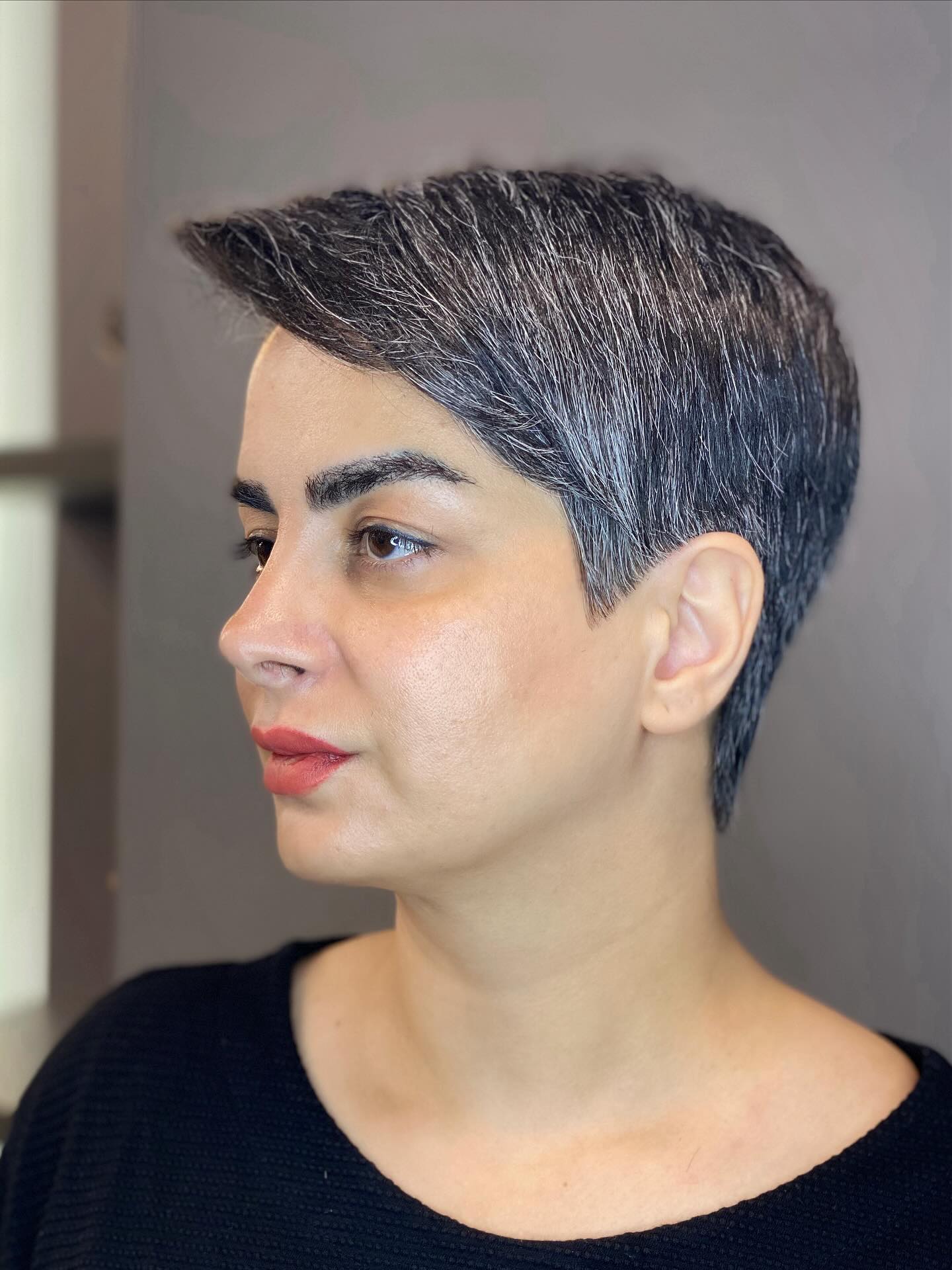 Modern Salt-and-Pepper Graduated Pixie with Side Sweep
